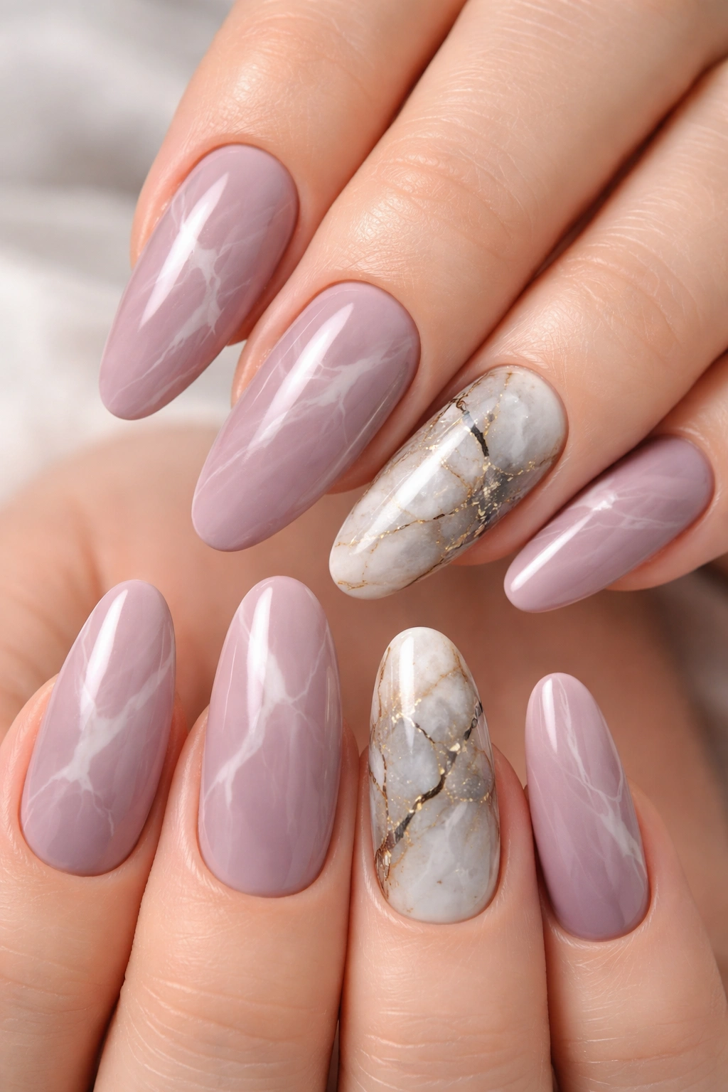 Dusty mauve nails with white and gray marble veins on accent nails