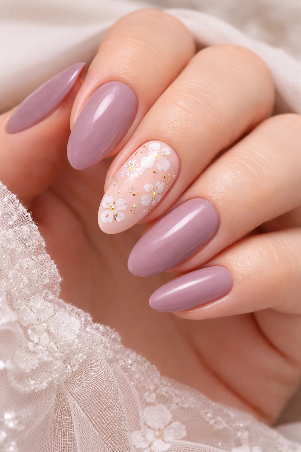 Mauve nails with peach pink accents and white floral details