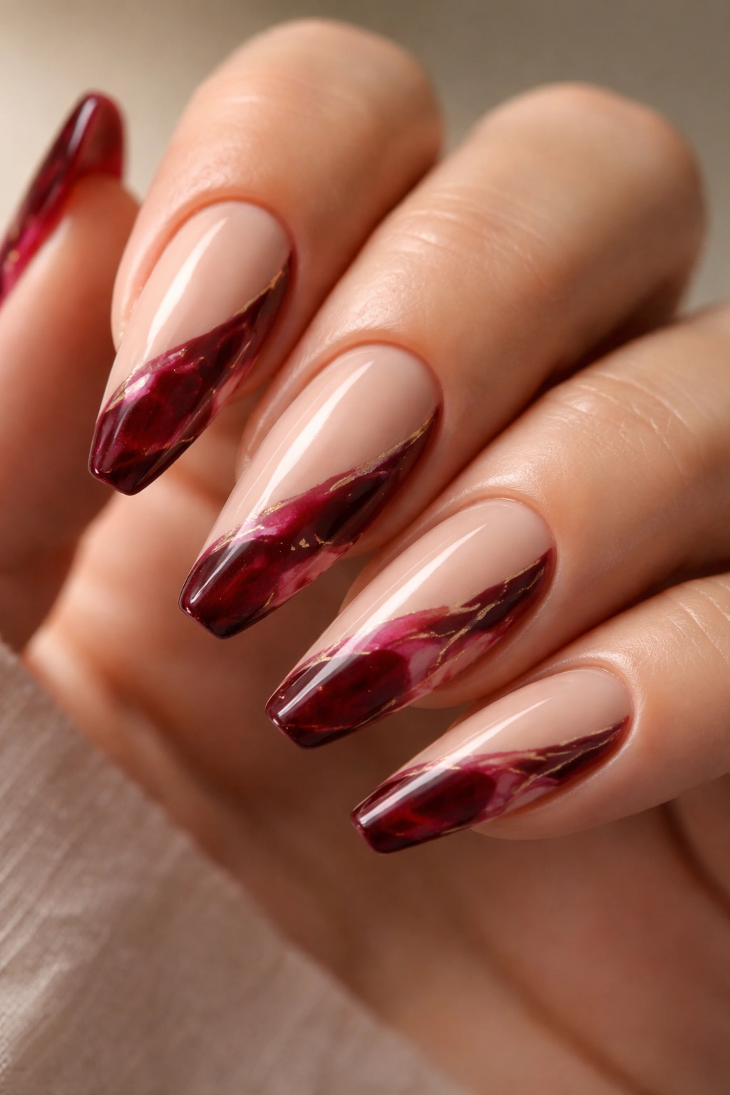Merlot marble nail with nude negative space on a ballerina shape