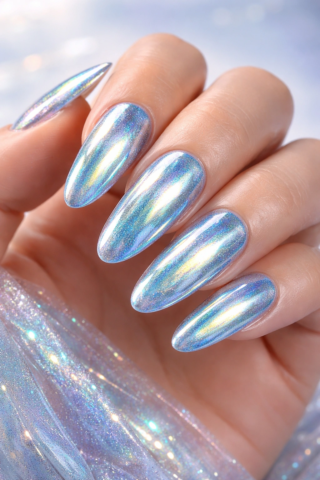 Mermaid chrome nails with iridescent blue-teal-gold shifts