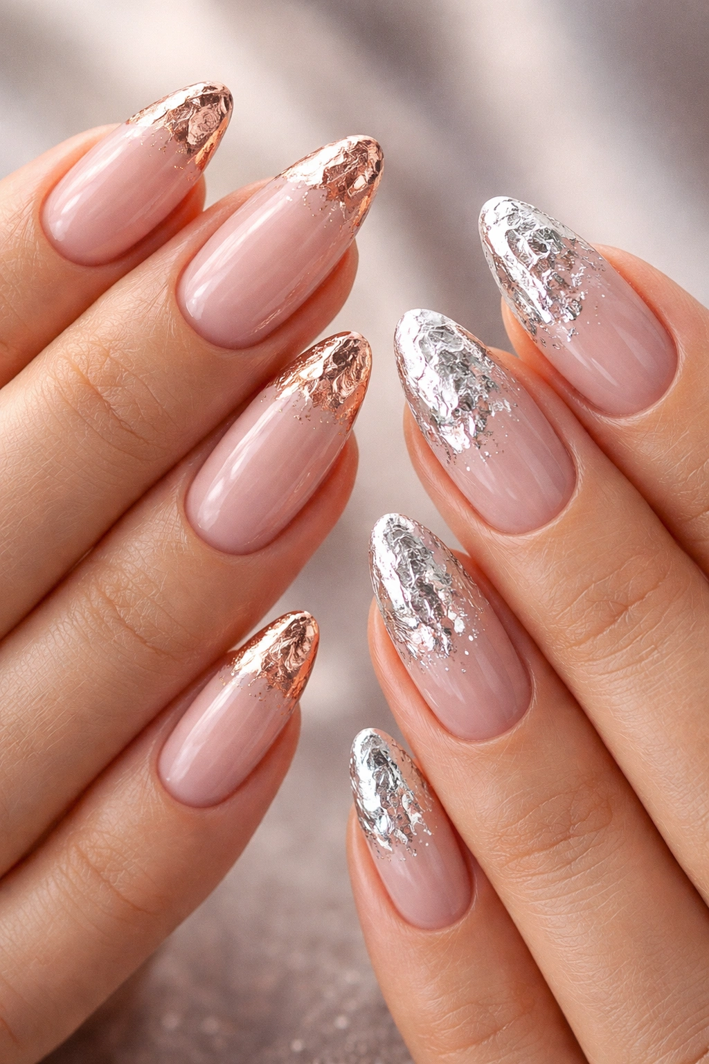 Almond nails with rose gold foil and silver foil accents on different hands