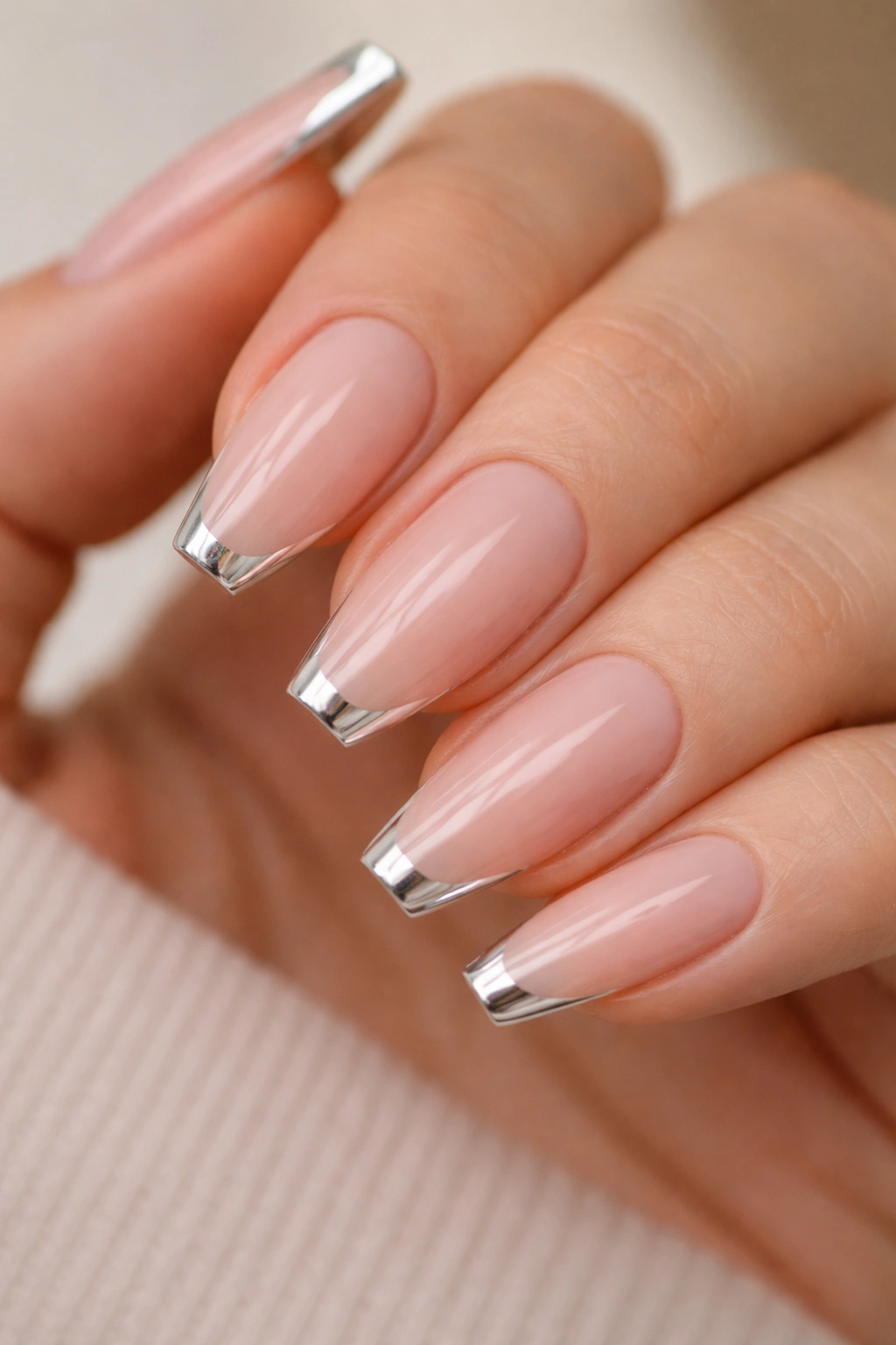 Nude base with a micro French chrome tip on ballerina nails
