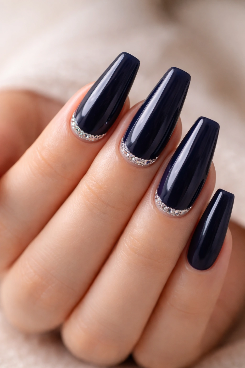 Midnight blue nails with crystal half moons at the cuticle