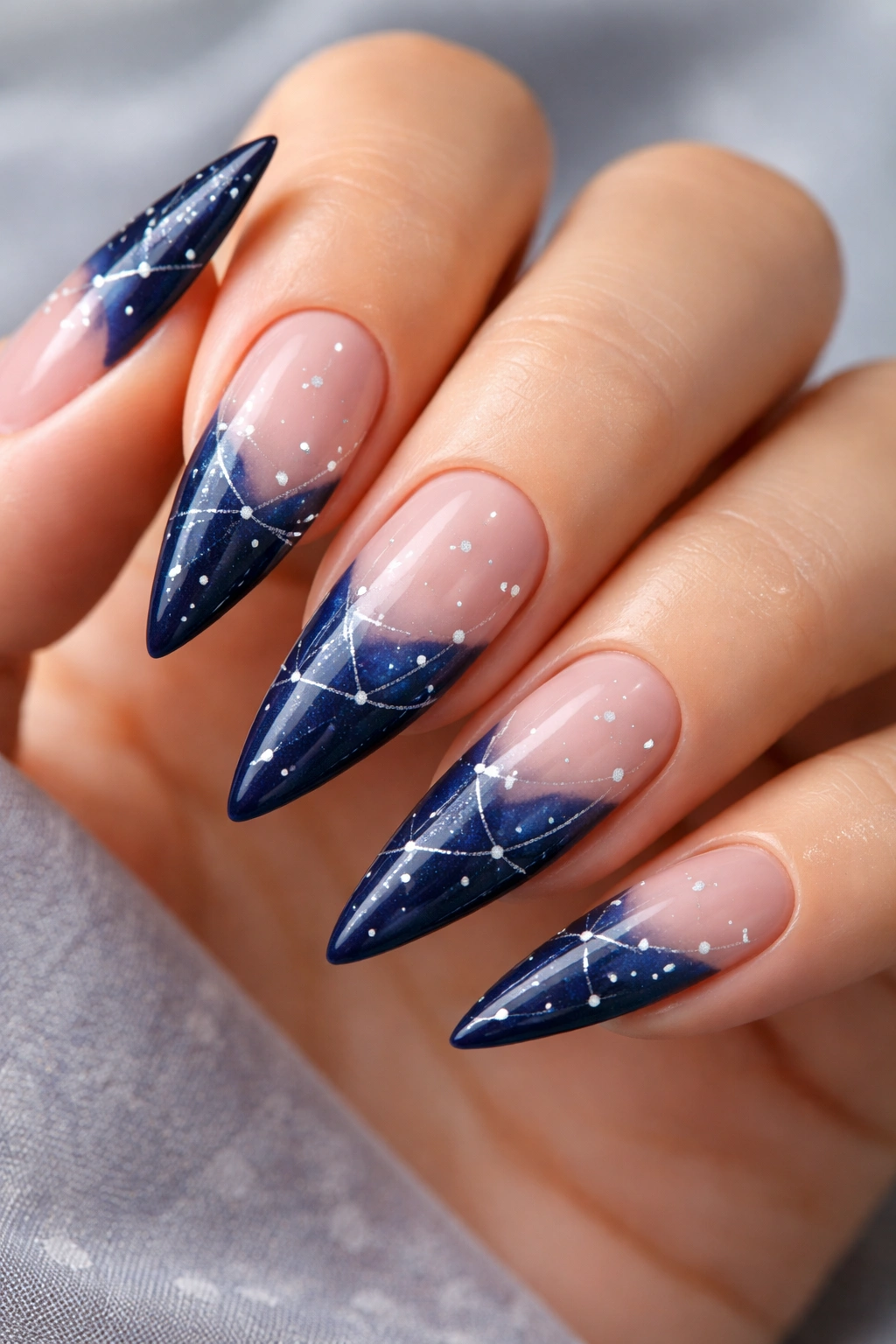 Midnight blue nails with constellation dot pattern