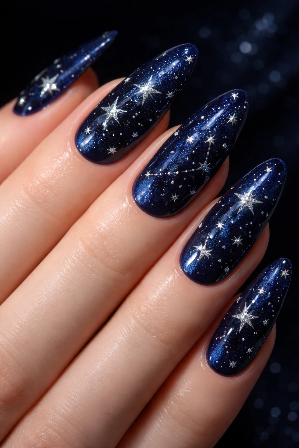 Midnight blue nails with silver star accents