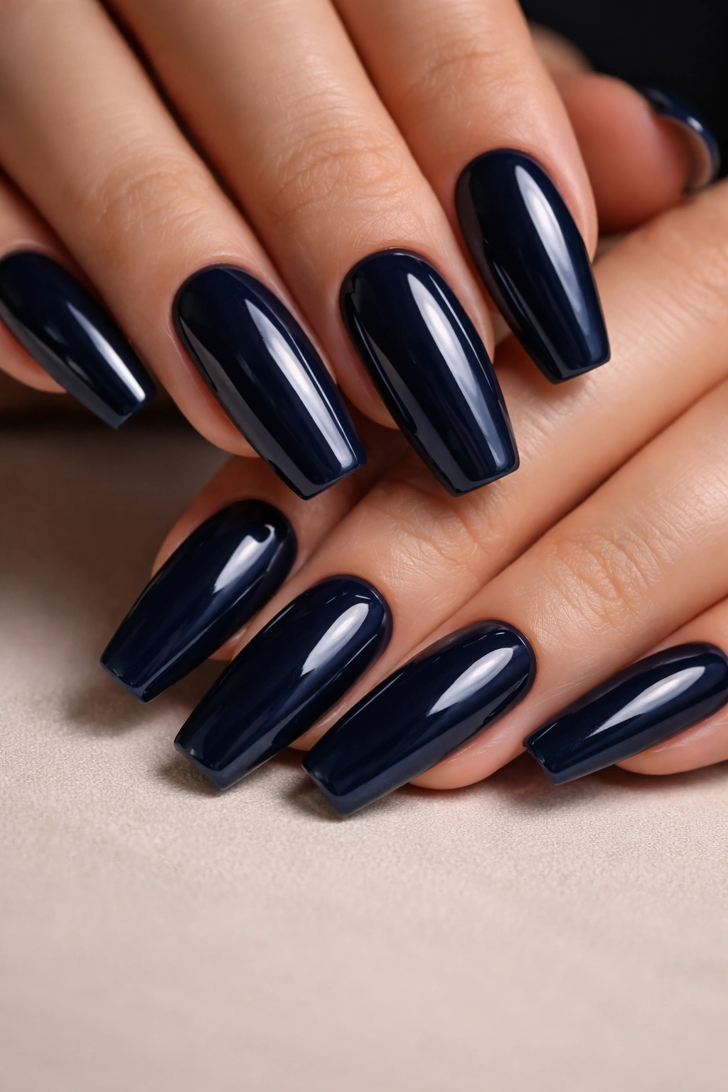 Midnight navy nails with high-gloss glassy top coat