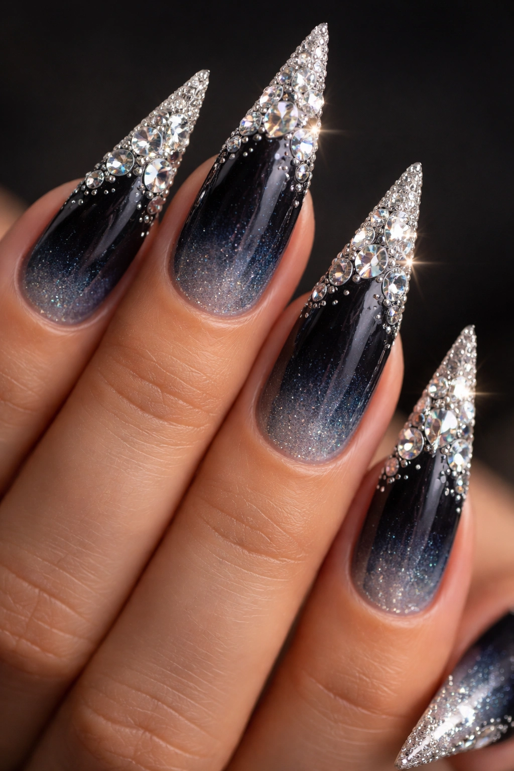 Stiletto nails in midnight blue to silver ombre with crystal point clusters