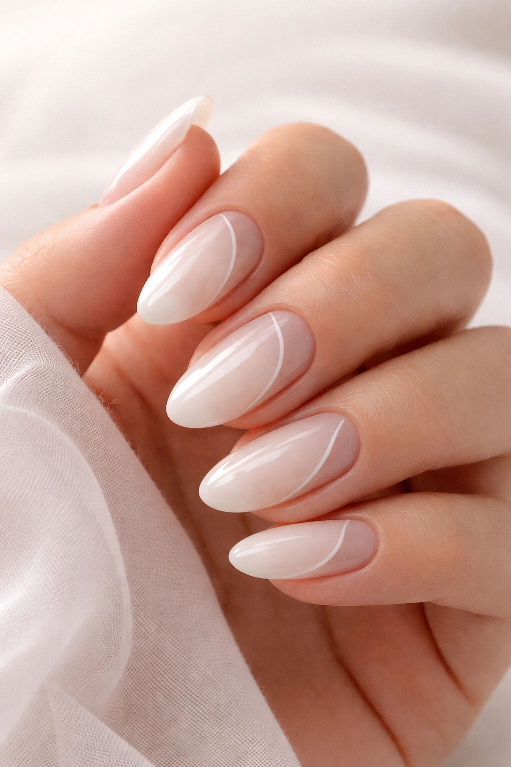 Close-up of milk bath nails with negative-space design