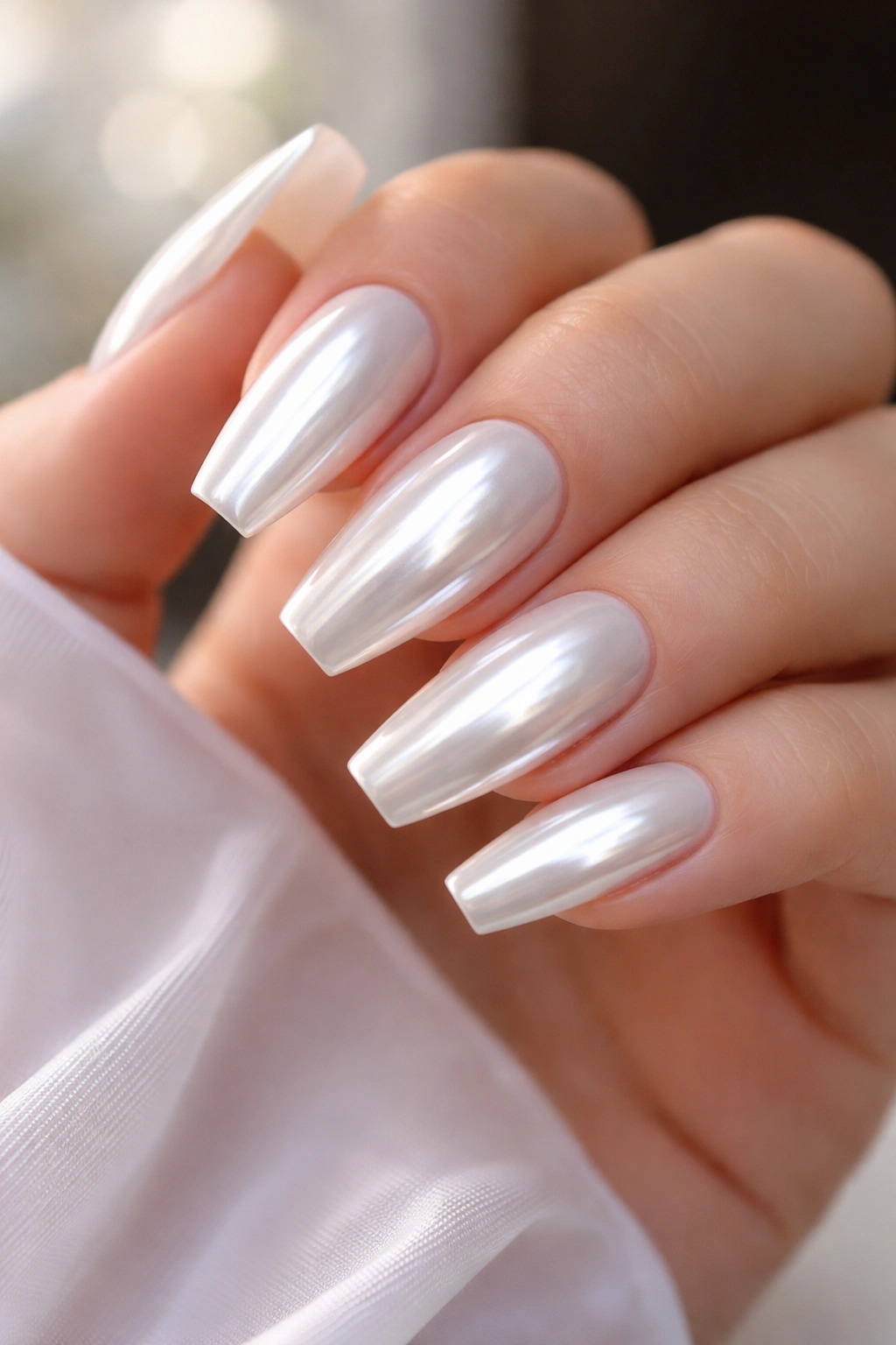 Milky white chrome nails with full mirror finish on ballerina shape