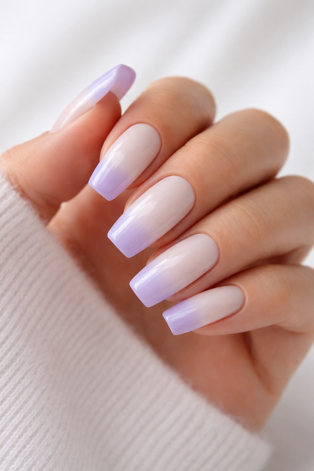 Milky white nails with soft lavender tips on coffin shape