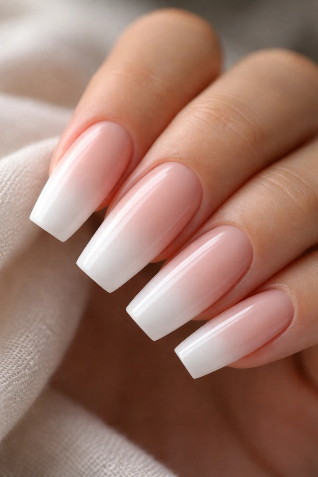 Medium-length ballerina nail with milky pink base and cloud white tip fade