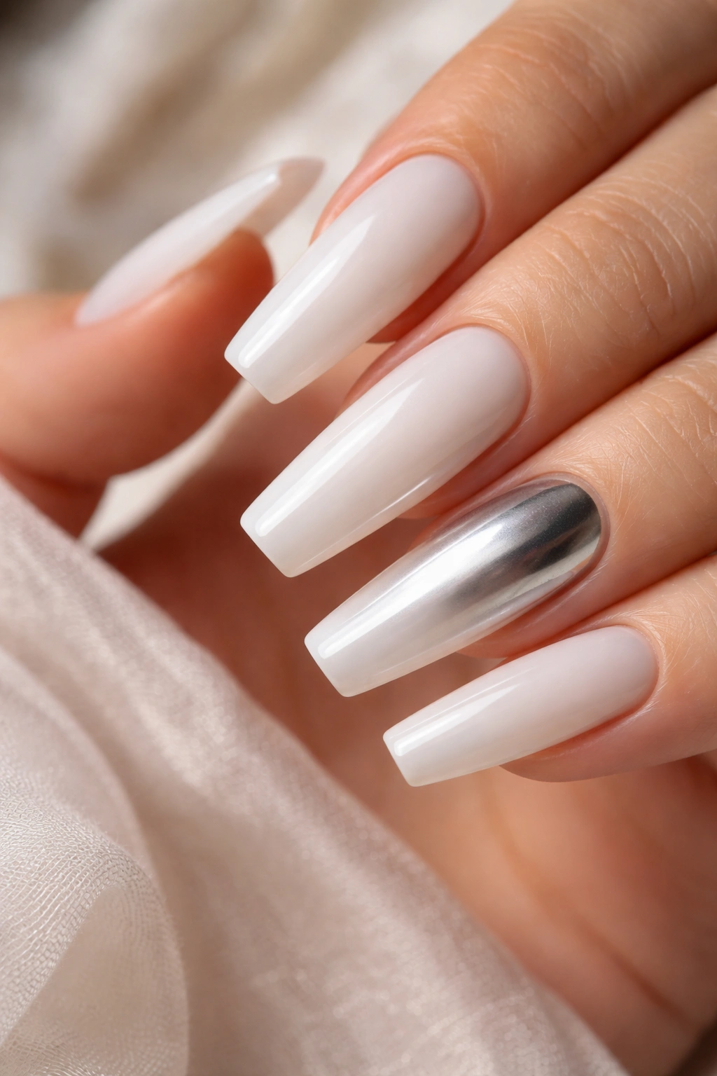 Milky white nails with chrome gradient accent nail