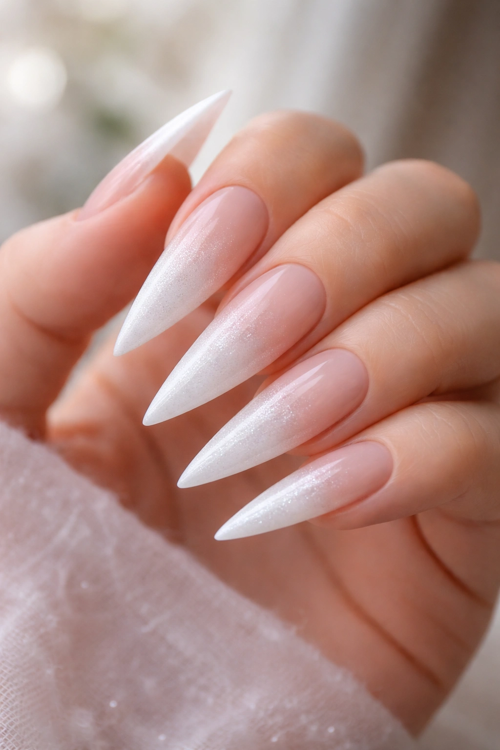 Close-up of Milky Frosted White Stilettos with Nude Ombré