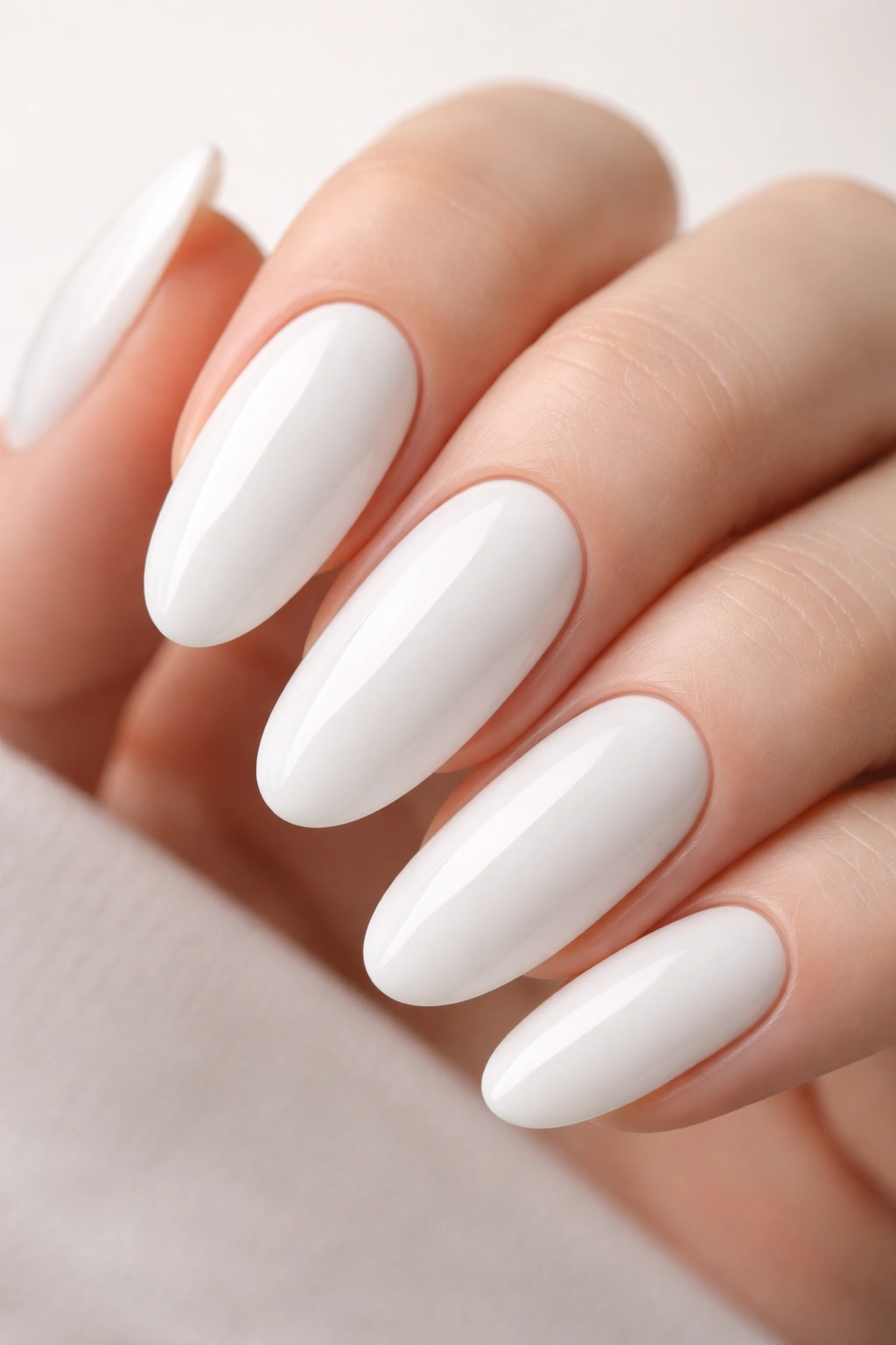 Long oval milky white nail with flawless opaque finish