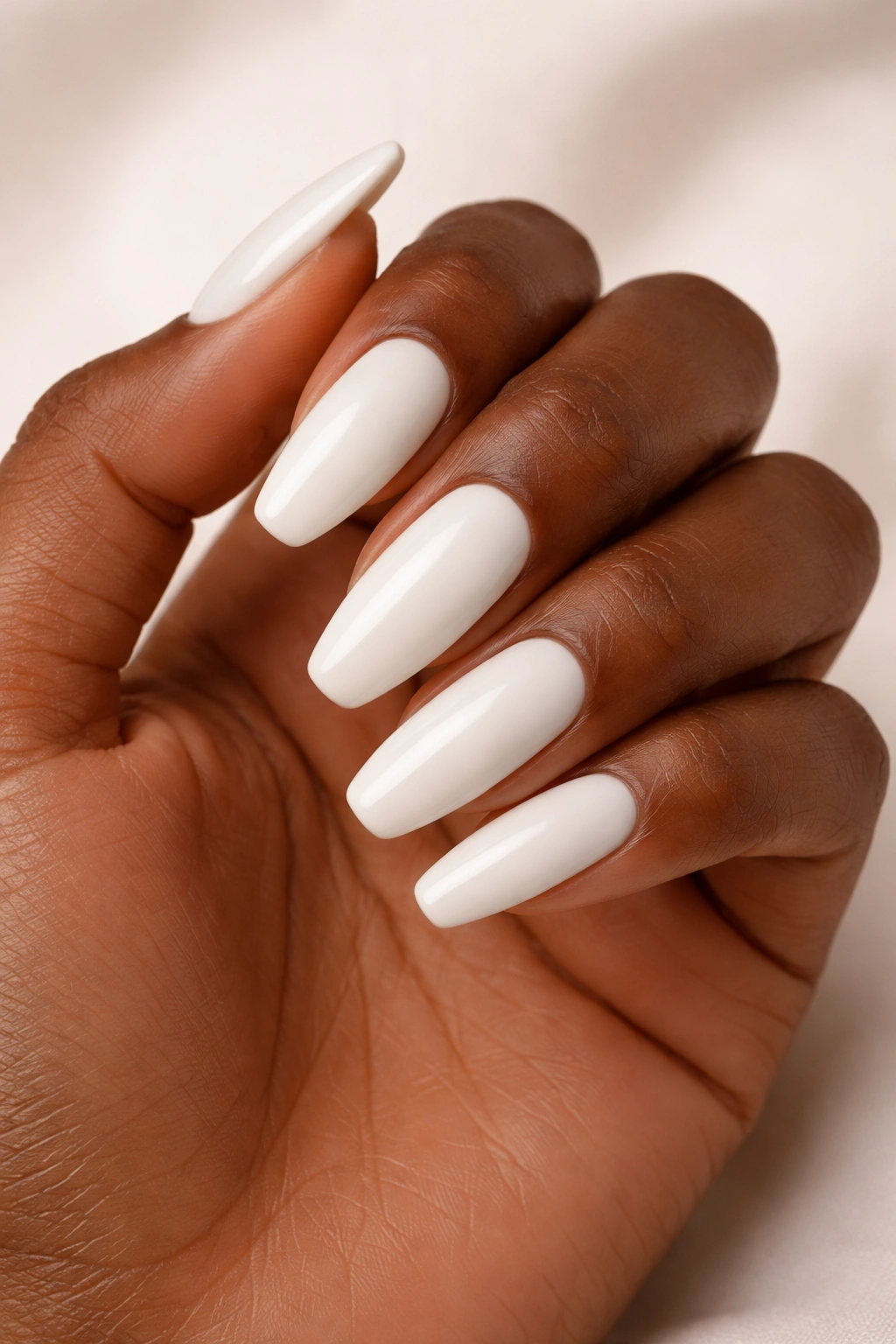 Milky white nails on almond coffin shape