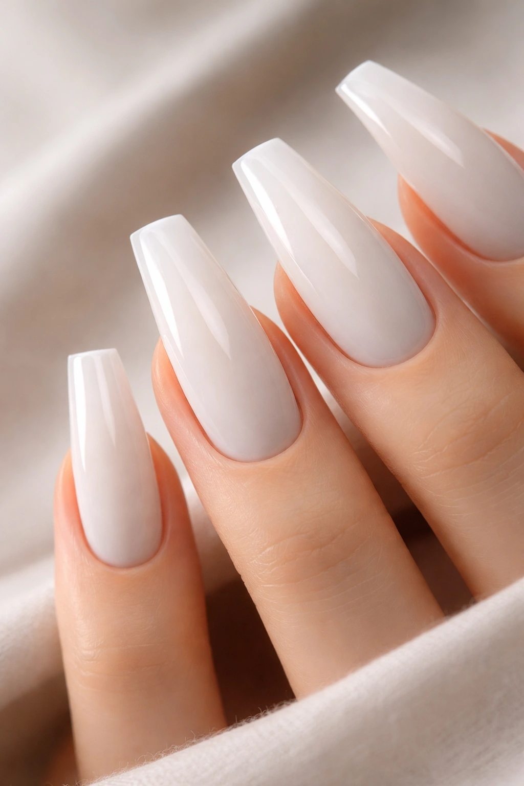 Milky white coffin nails with subtle gray shadow outline for dimension