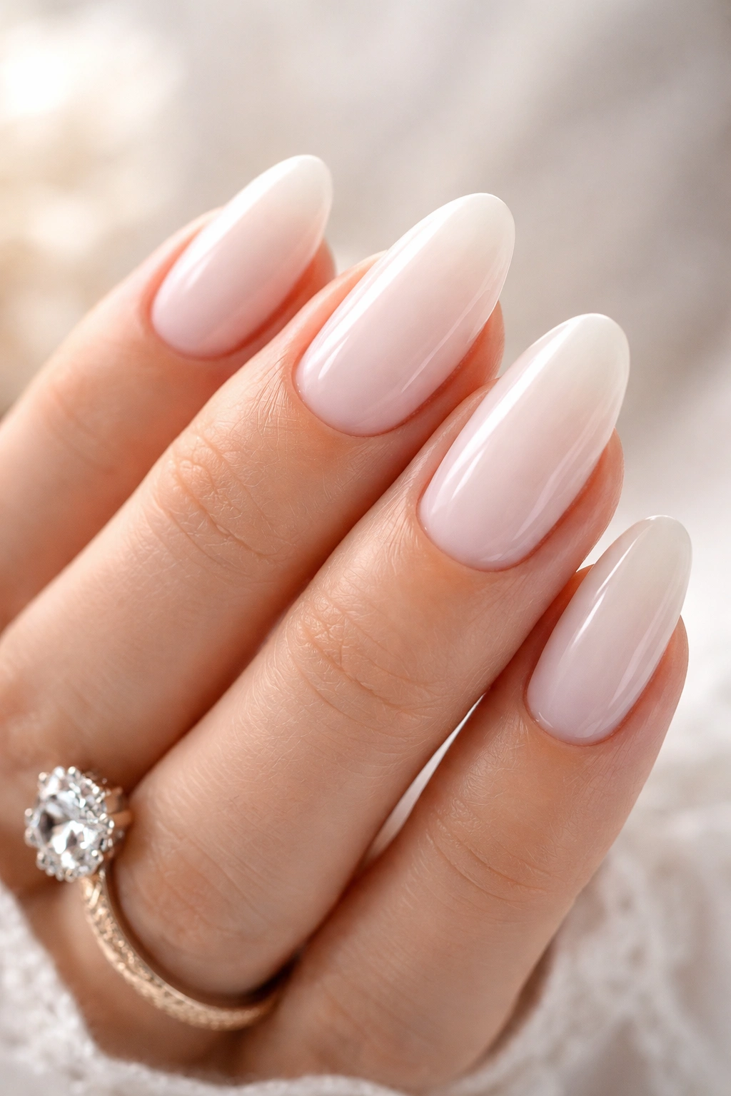 Close-up of milky white nails with translucent opacity