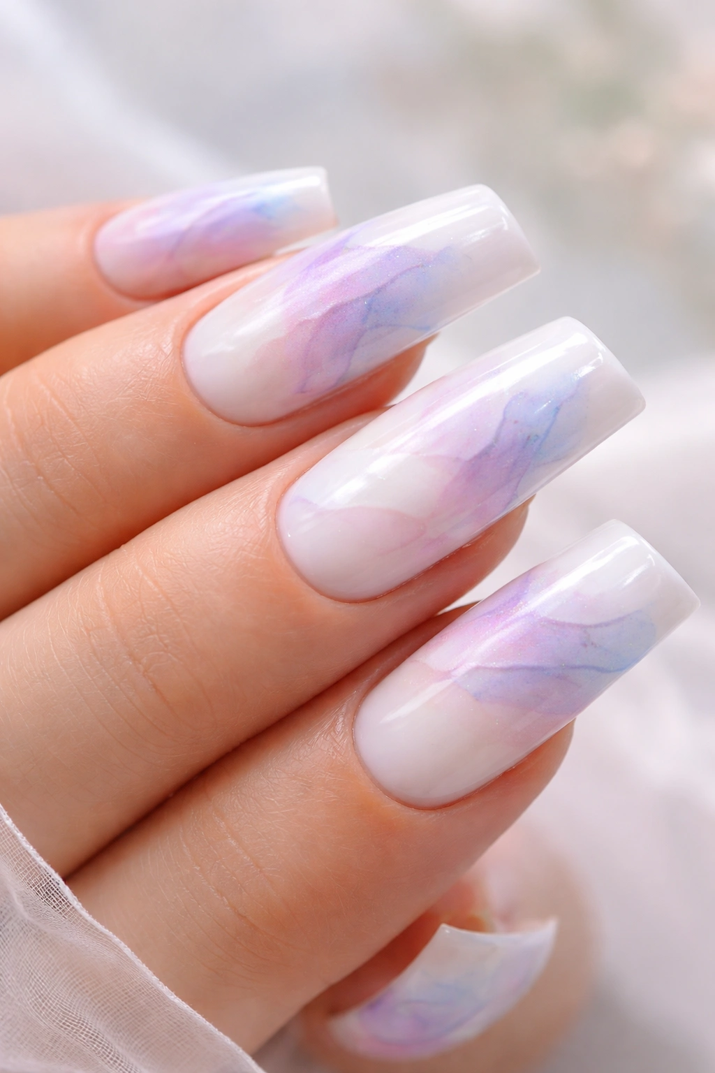 Milky white curved duck nails with abstract watercolor