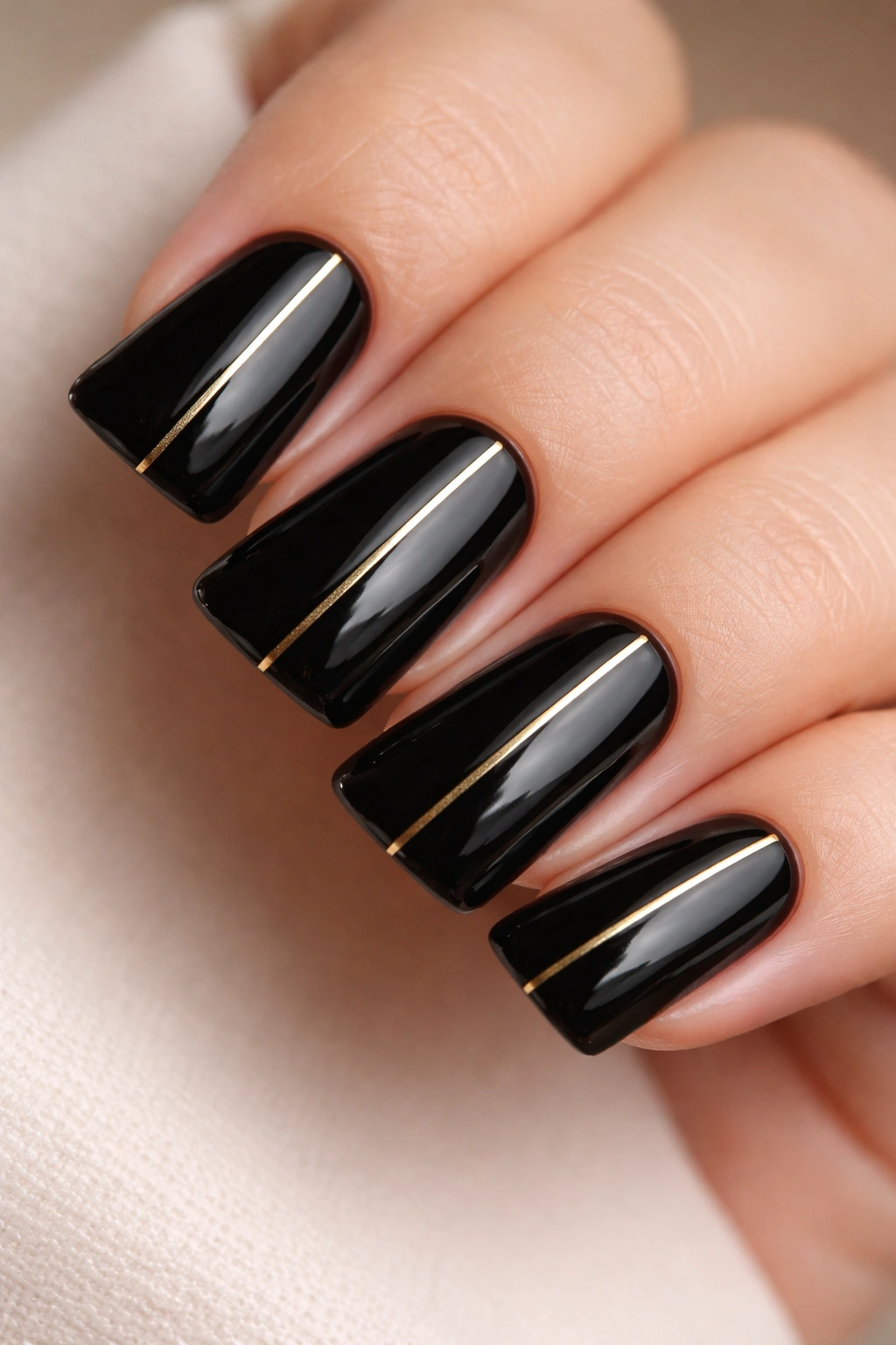 Short black duck nails with a single gold line