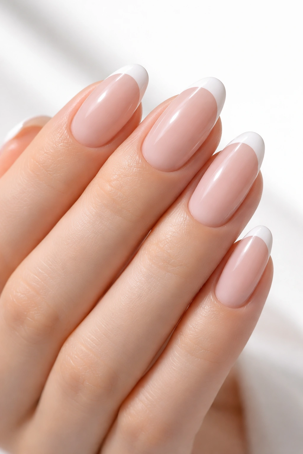 Long round nails with ultra-thin white tip on nude base