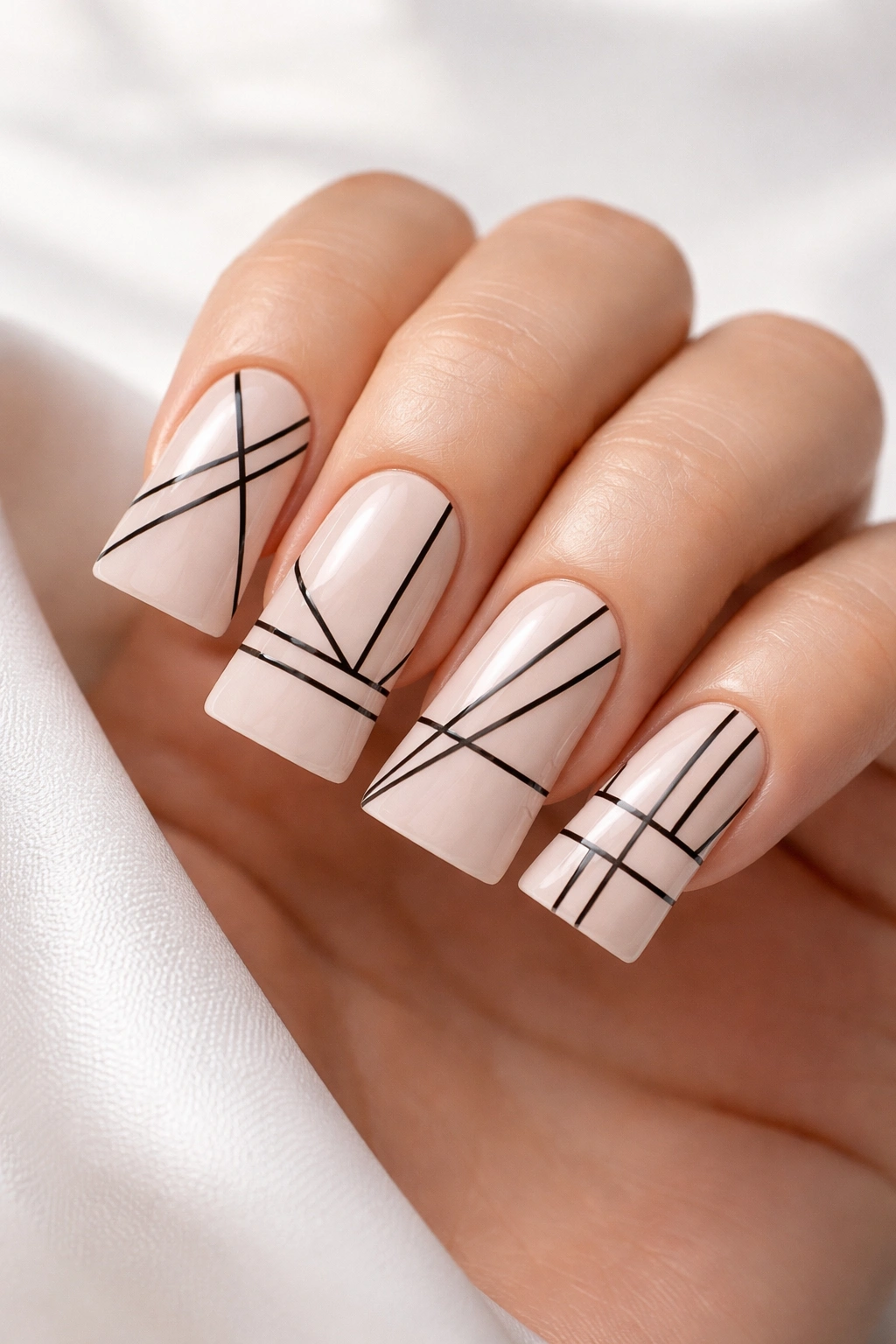 Close-up of wide duck nails with minimalist geometric line art