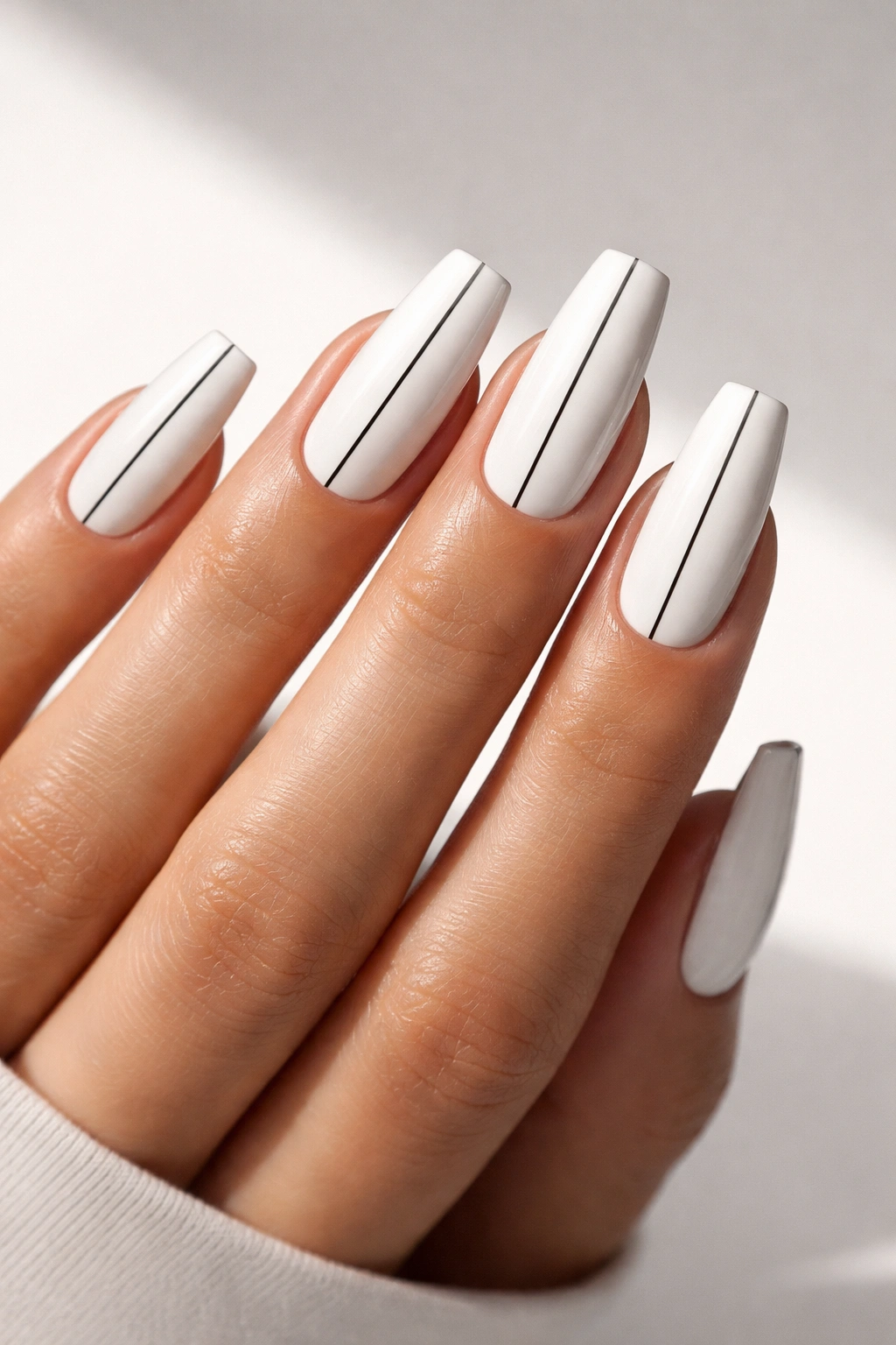 Close-up of coffin nails with a single vertical black line on white base
