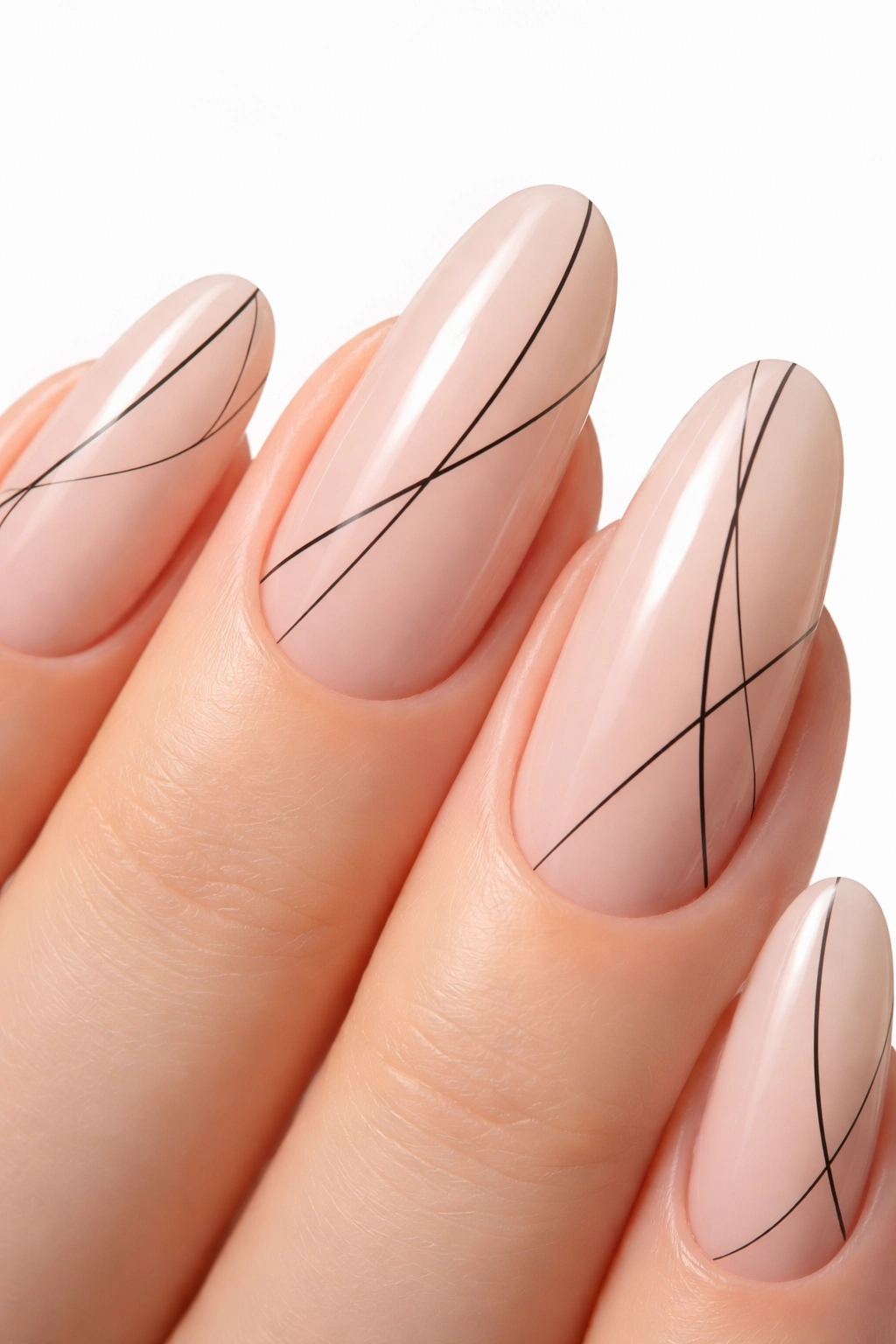 Close-up of a nude round acrylic nail with fine black line geometric art