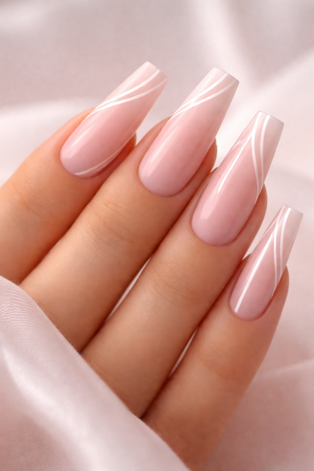 Coffin nails with thin white lines on pink base