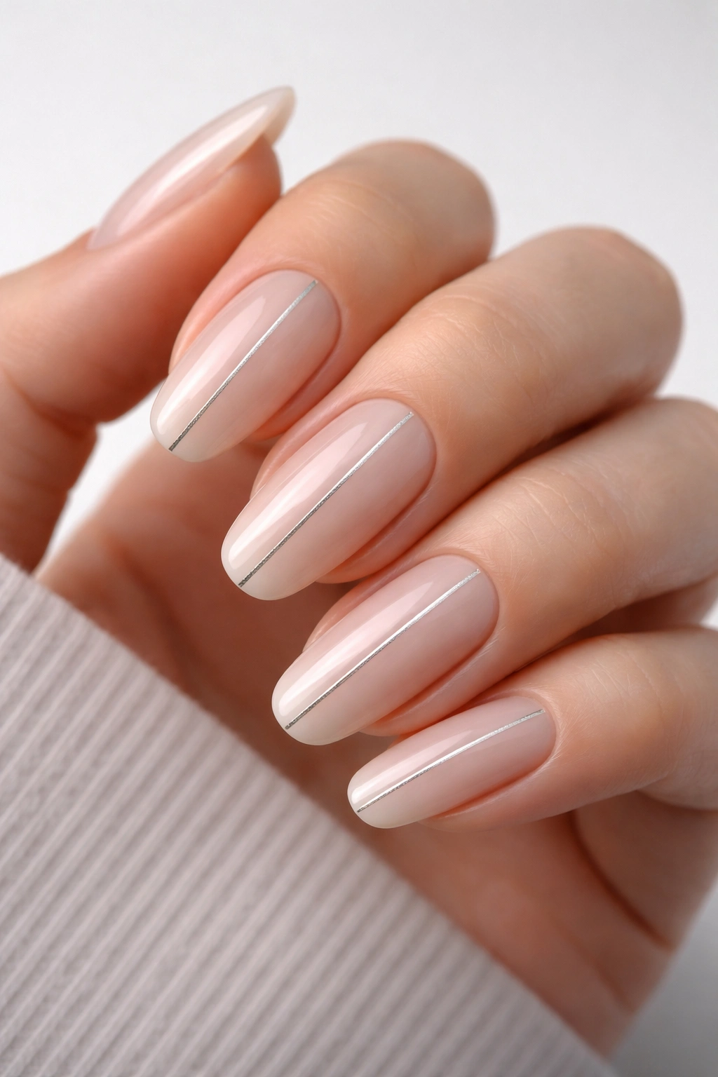 Long round nails with a single fine line detail