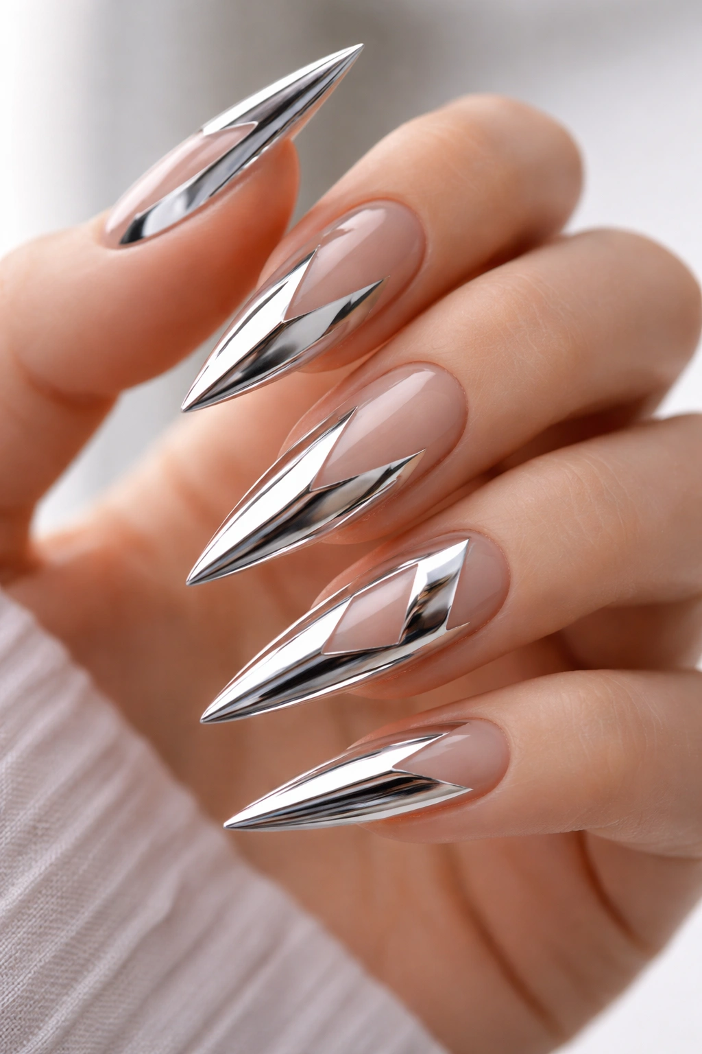 Nails with mirror chrome geometric shapes and negative space