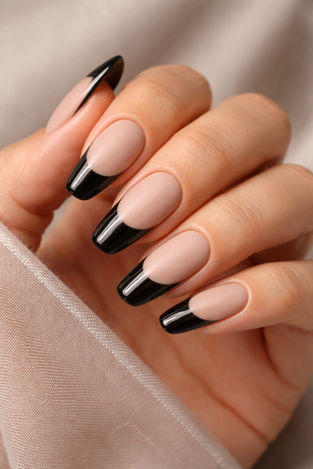 Nails with matte base and glossy tips shown close-up