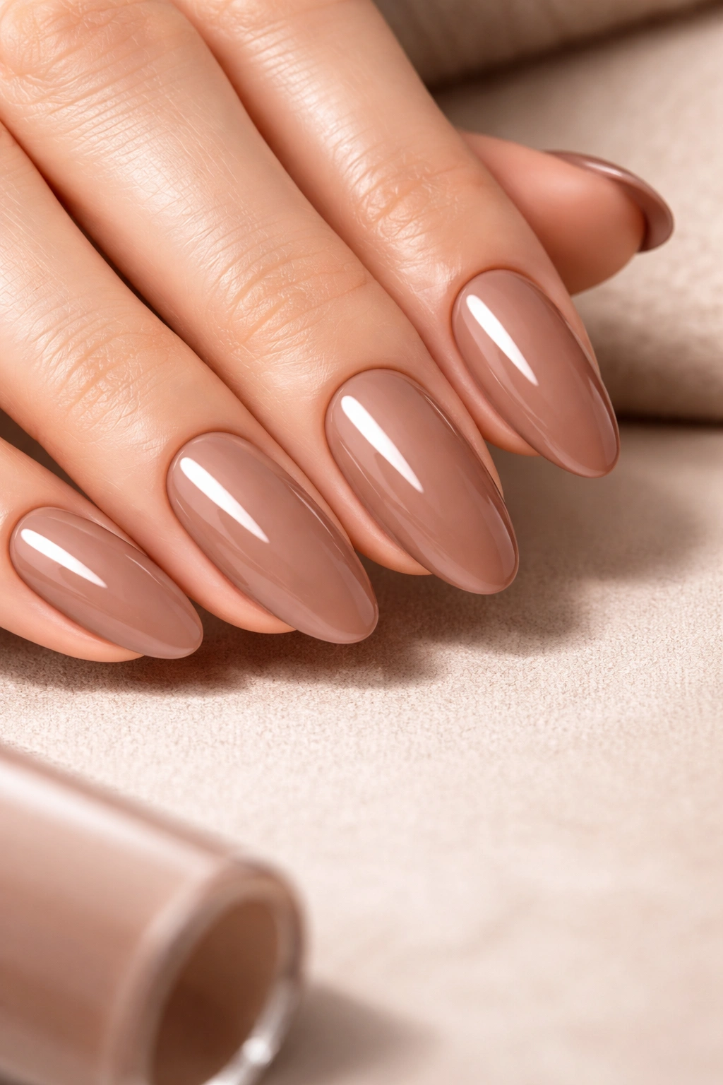 Mocha mousse nails showing long-wear glossy finish
