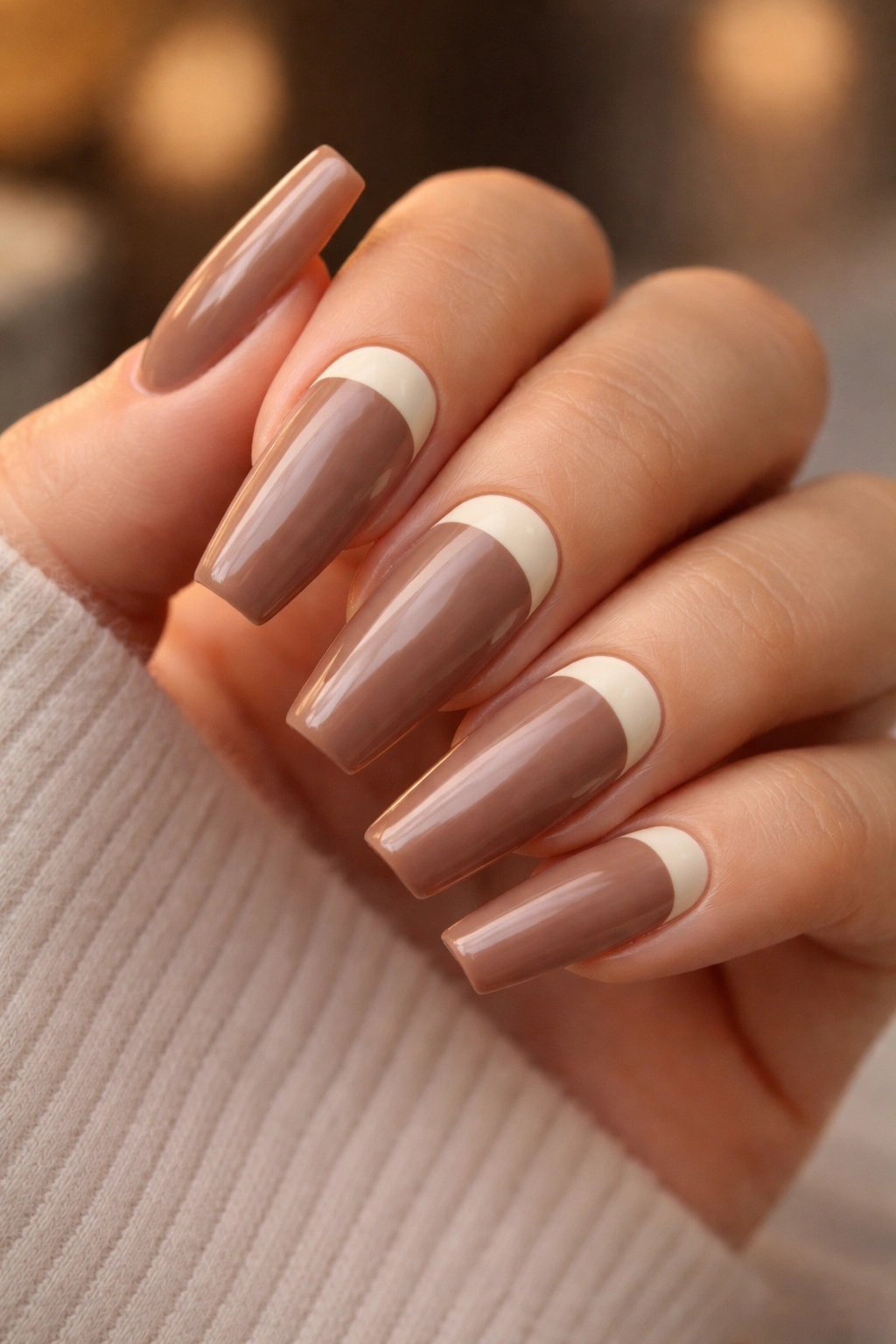 Mocha nails with cream half-moons at the cuticle