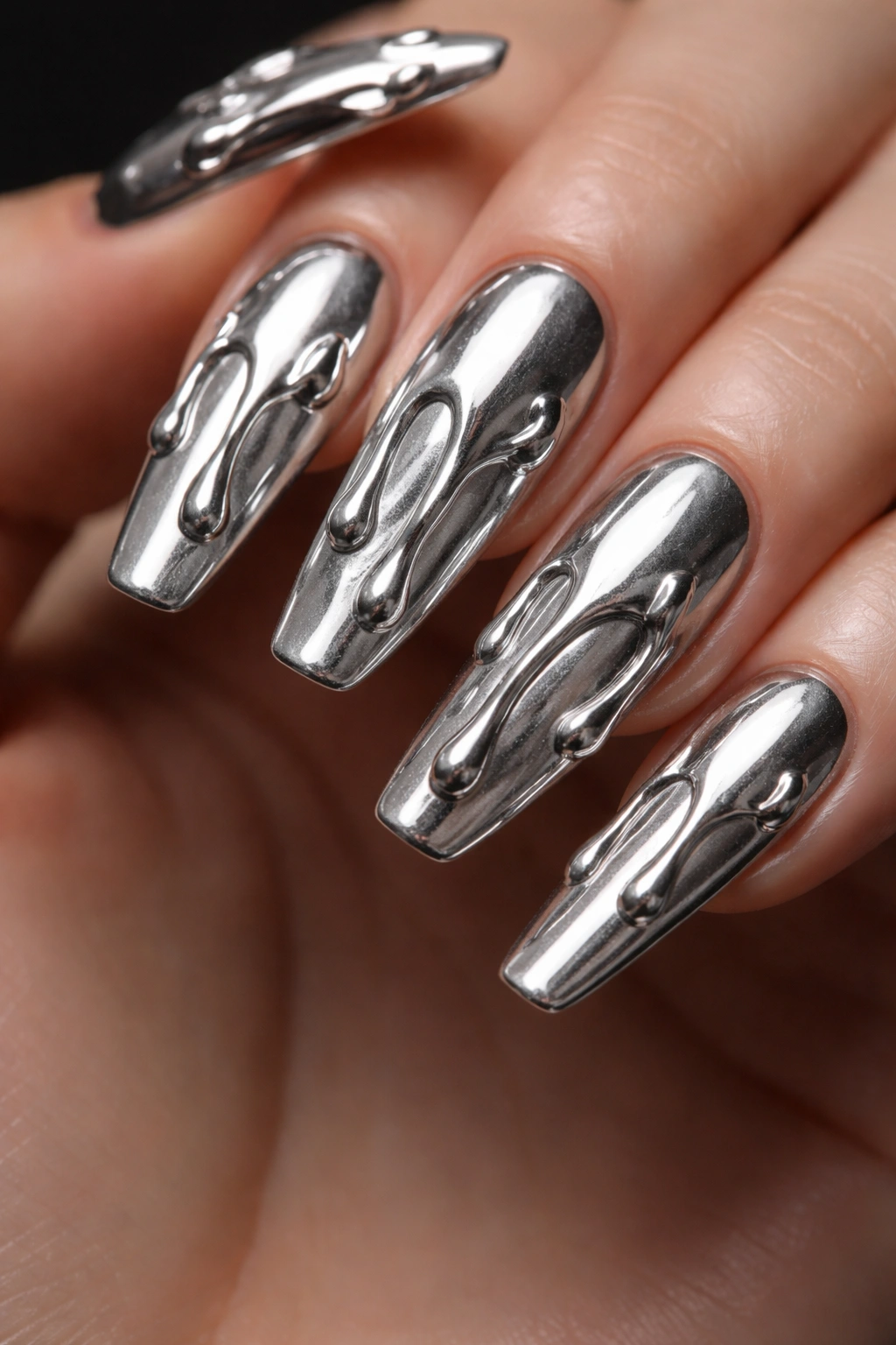 Raised silver chrome drip nails with liquid-metal texture