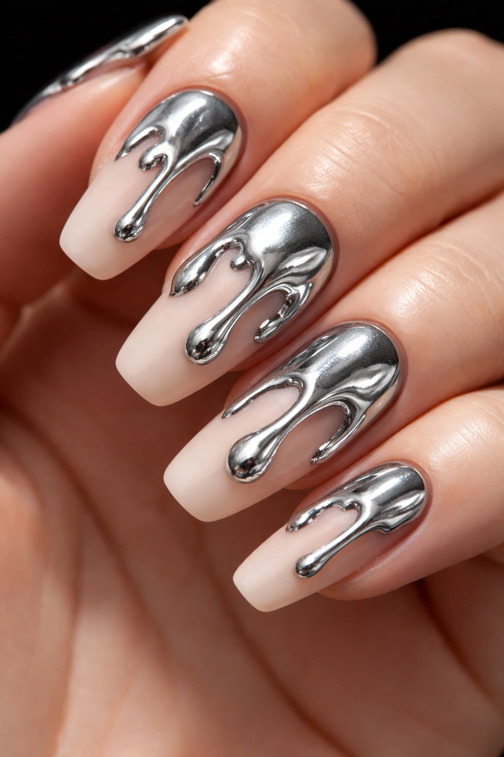 Nails with molten metal chrome drips on a matte base