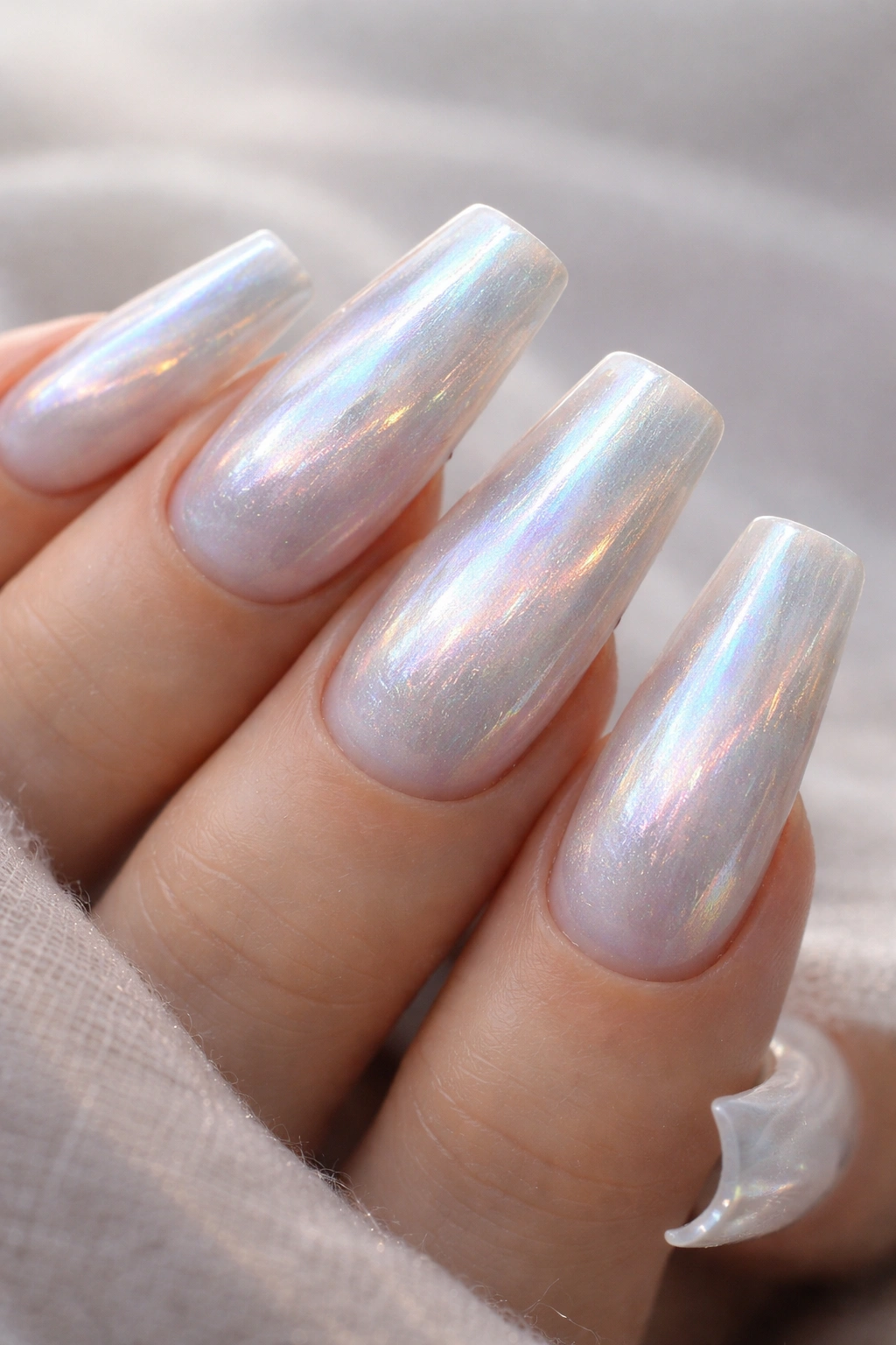 Duck nails with moonstone shimmer and pale beige base