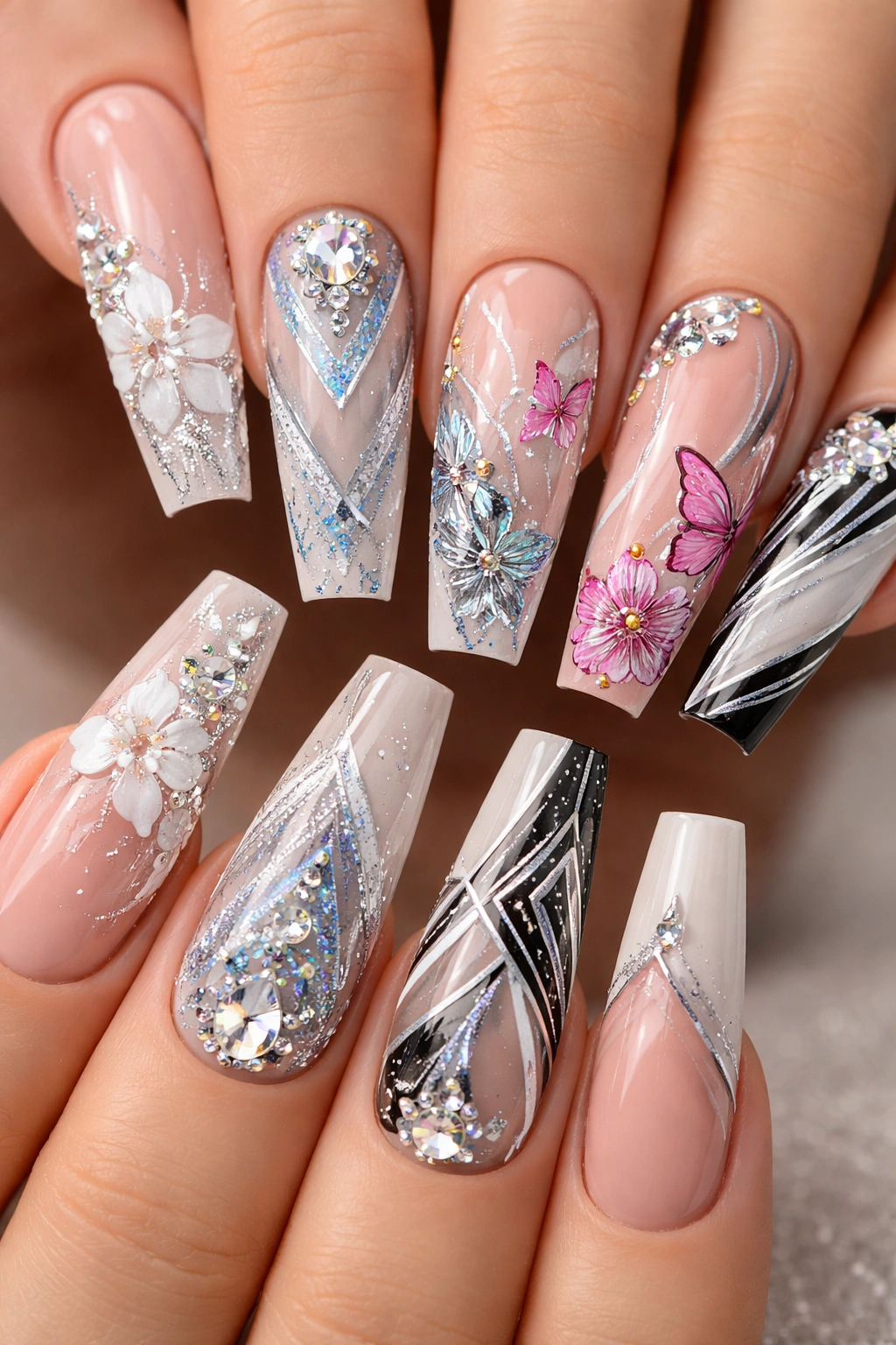 Coffin nails featuring floral and geometric nail art on squared tips