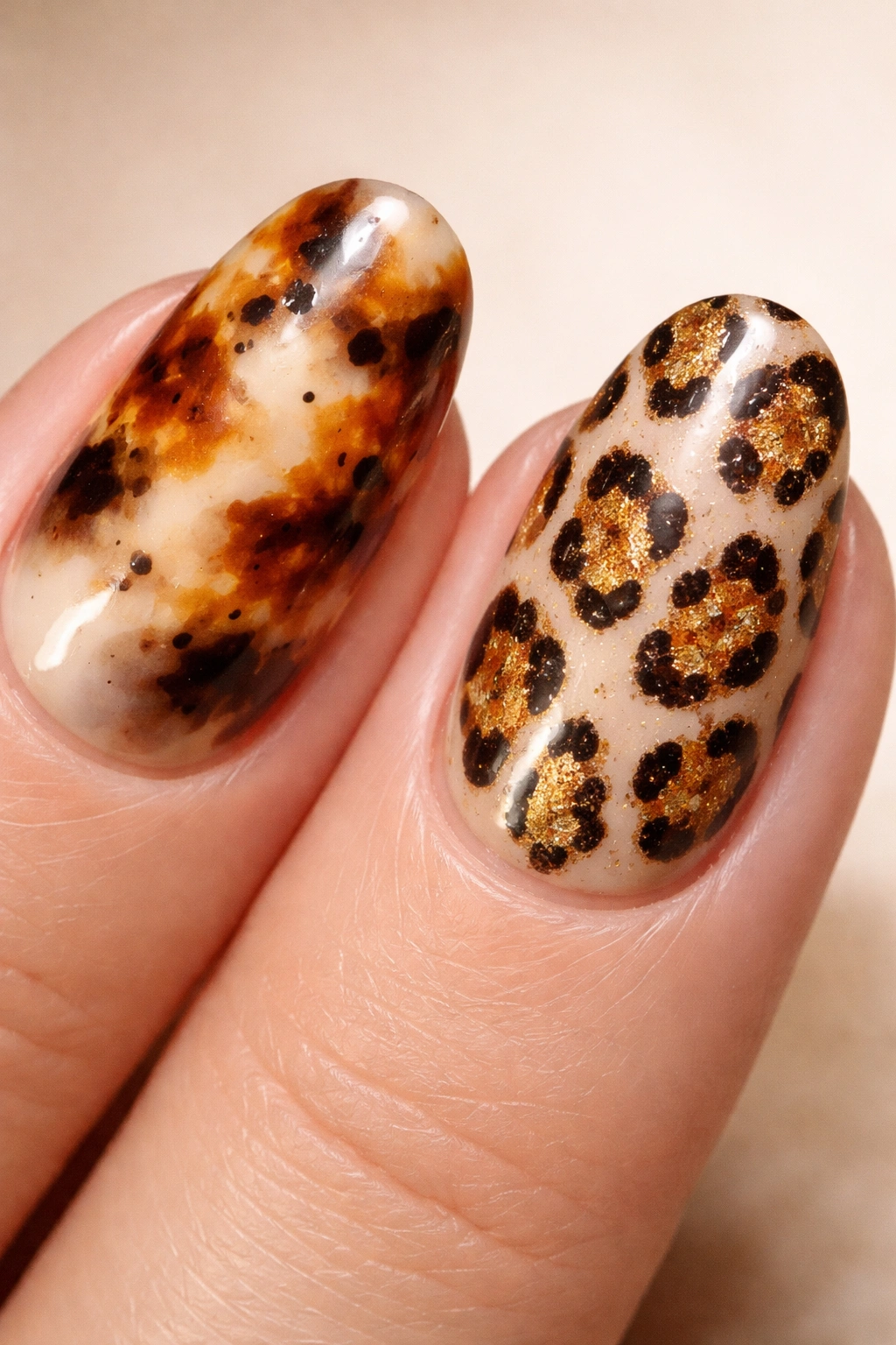 Close-up of nails showing tortoiseshell and leopard print patterns