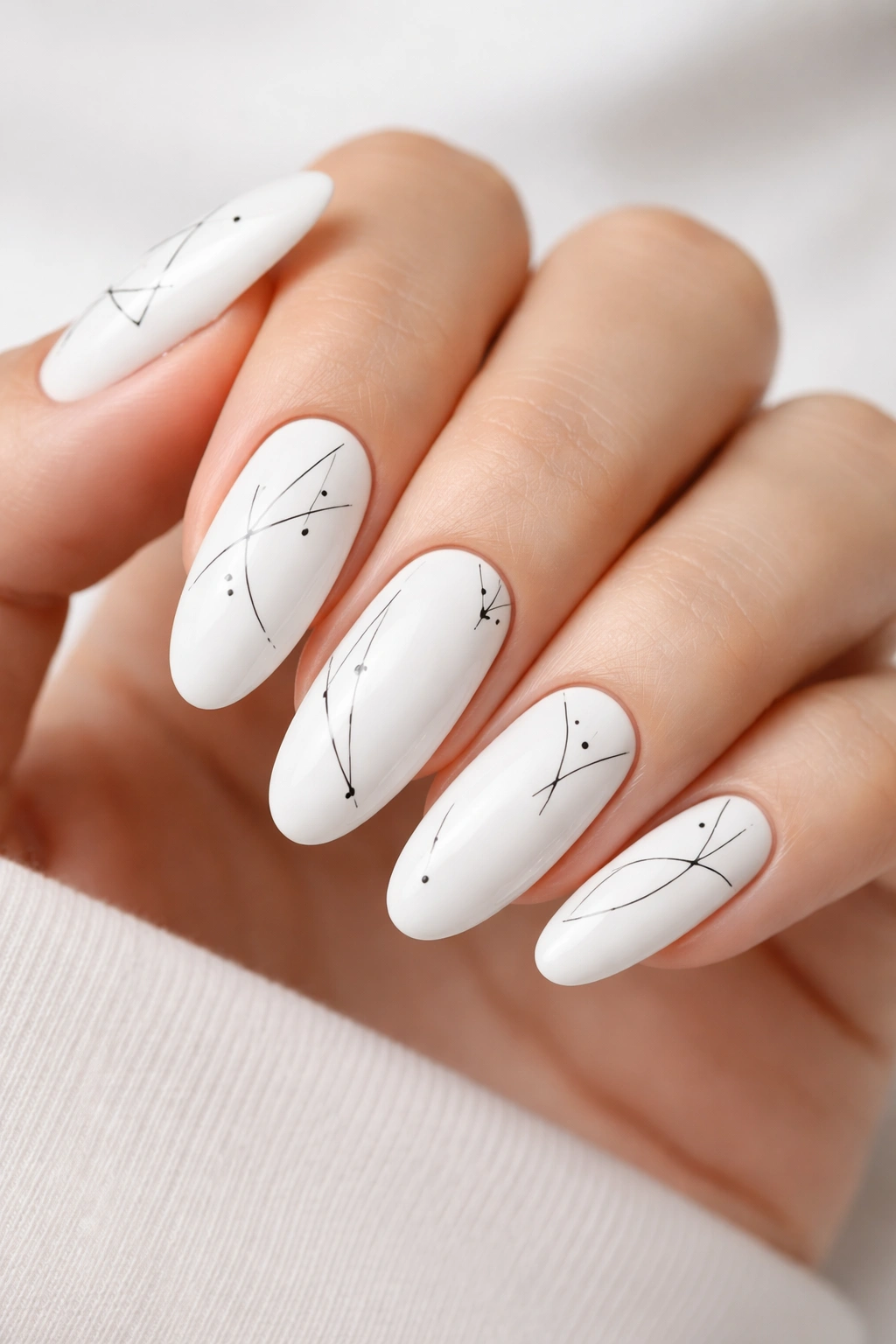 Long oval nails white base with black line work minimalist art