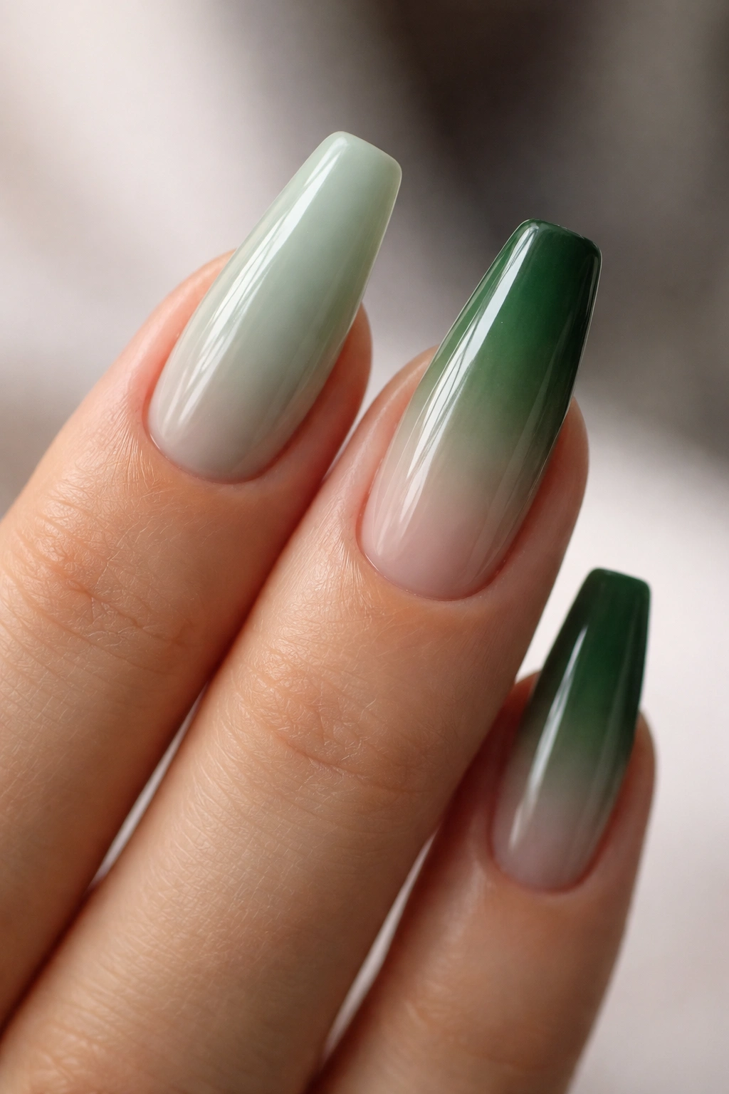 Nail swatches milky sage and hunter green ombré showing wearable colors