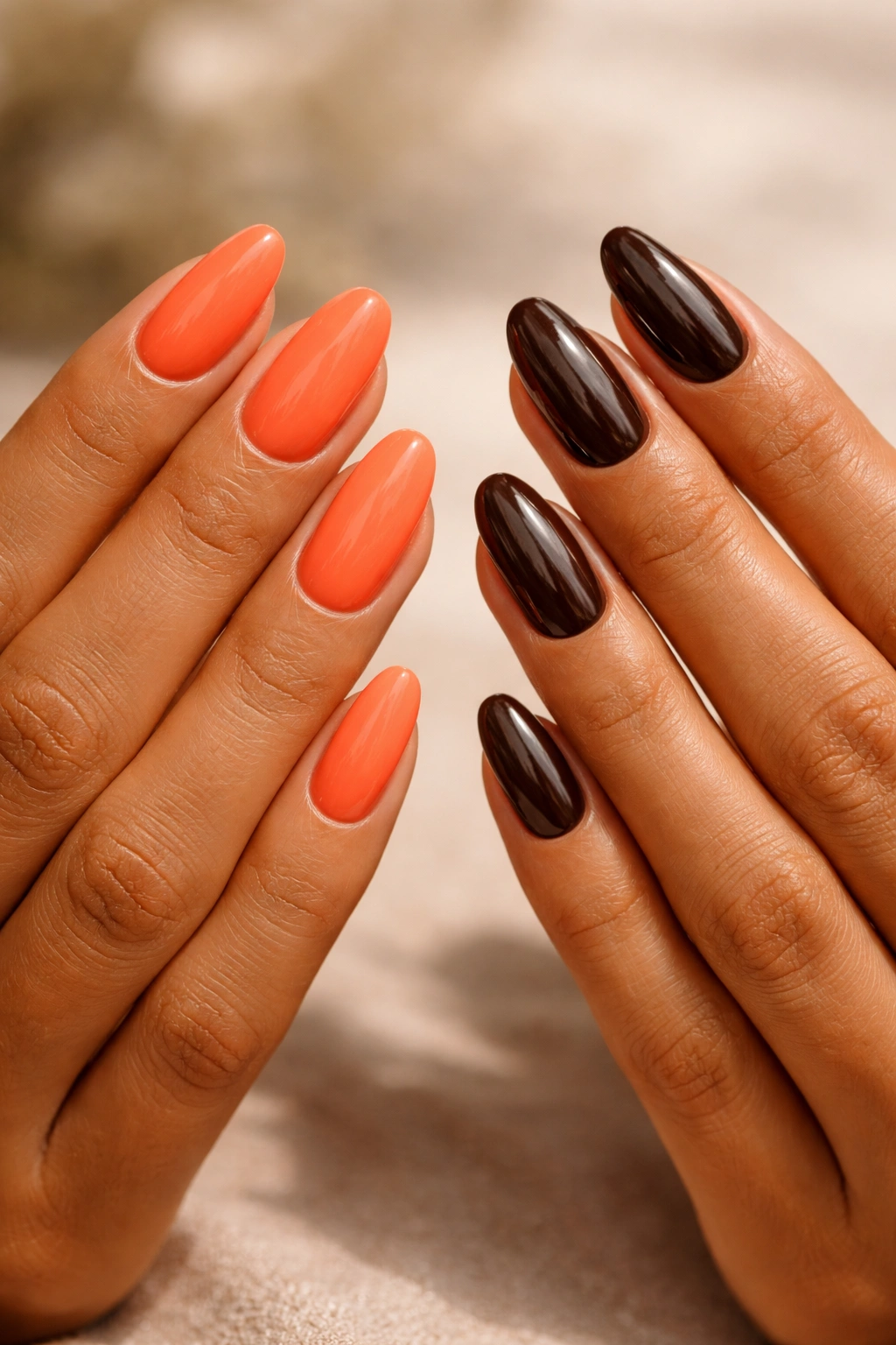 Close-up of nails in coral and chocolate brown showing mood psychology