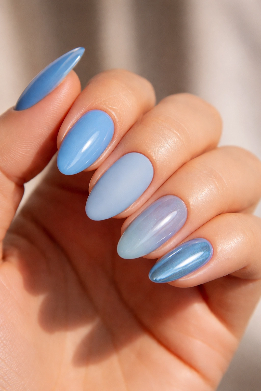 Close-up of nails showing four finishes: gloss, matte, jelly, chrome