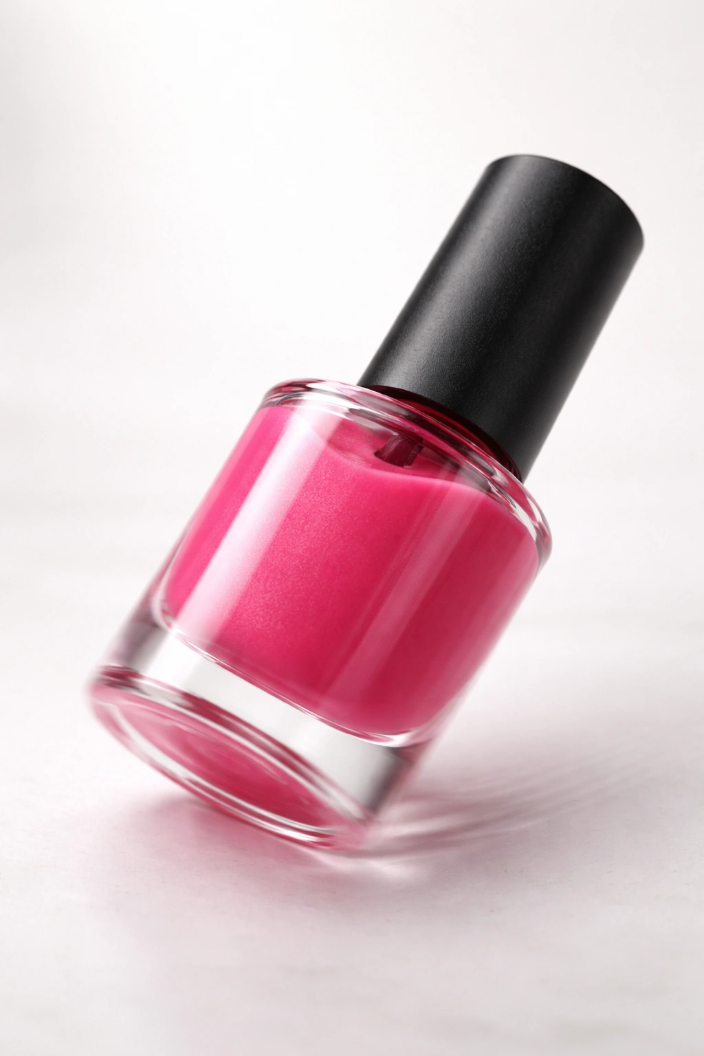 Polish bottle on a clean surface with motion blur suggesting rolling as a common mistake