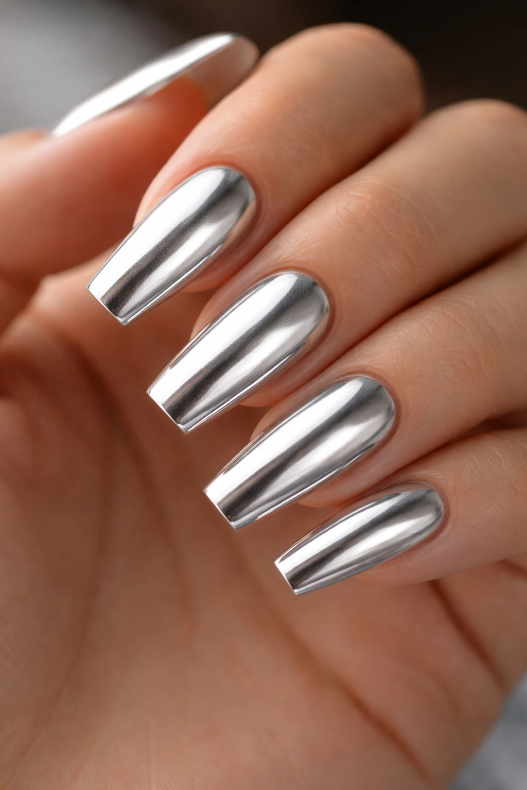 Close-up of nails showing smooth metallic base and clean apex