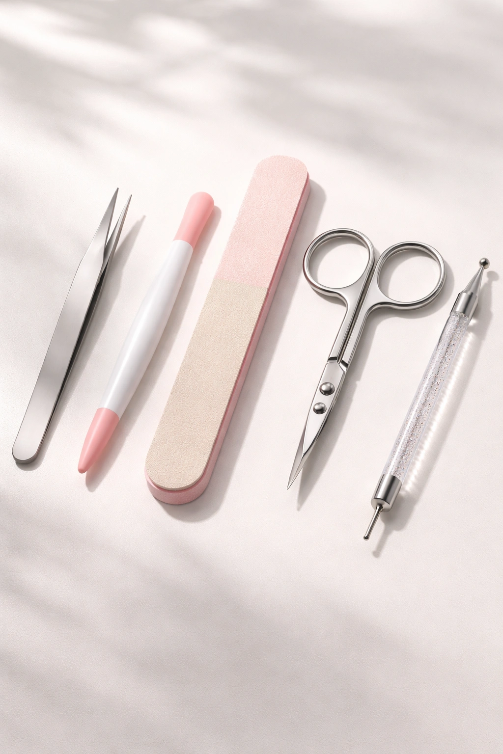 Close-up of essential nail sticker tools arranged neatly