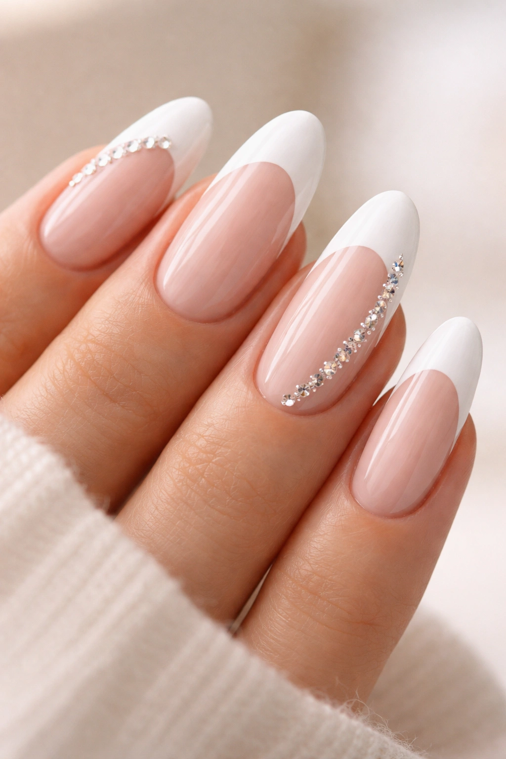 French tip long oval nails with a single crystal trail