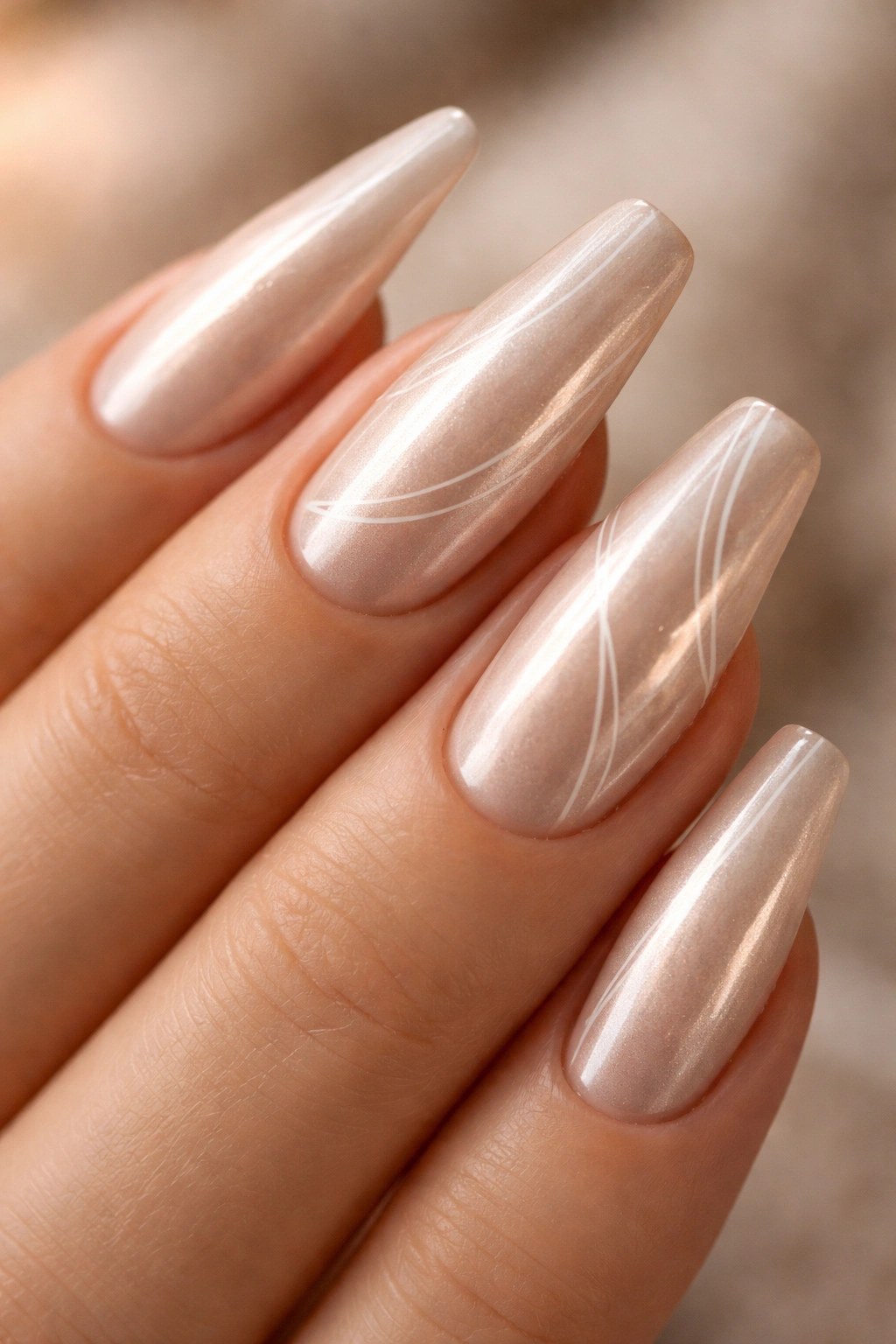 Vanilla nude chrome nails with fine white line art on ballerina nails