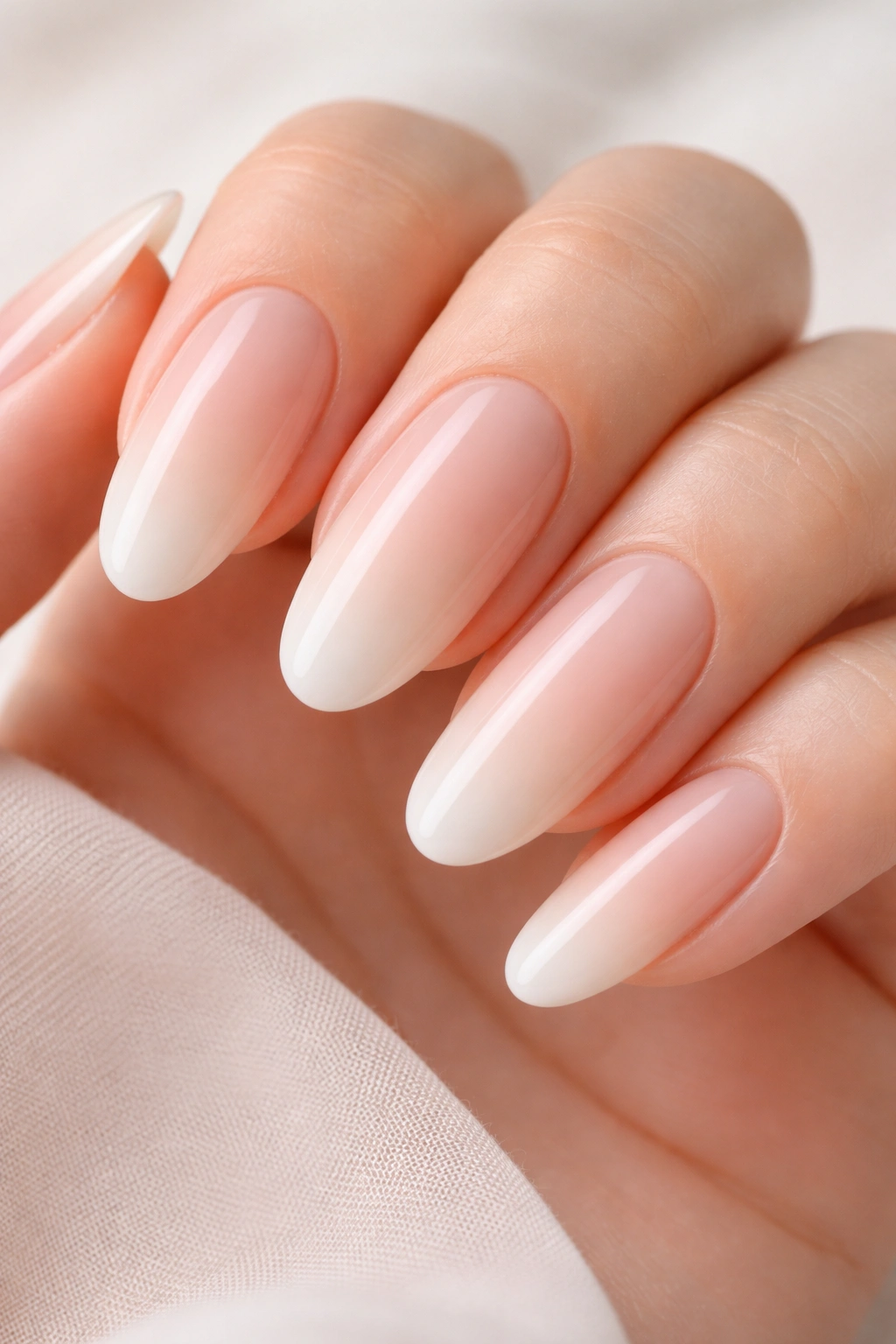 Oval nails with a seamless nude gradient from base to tip