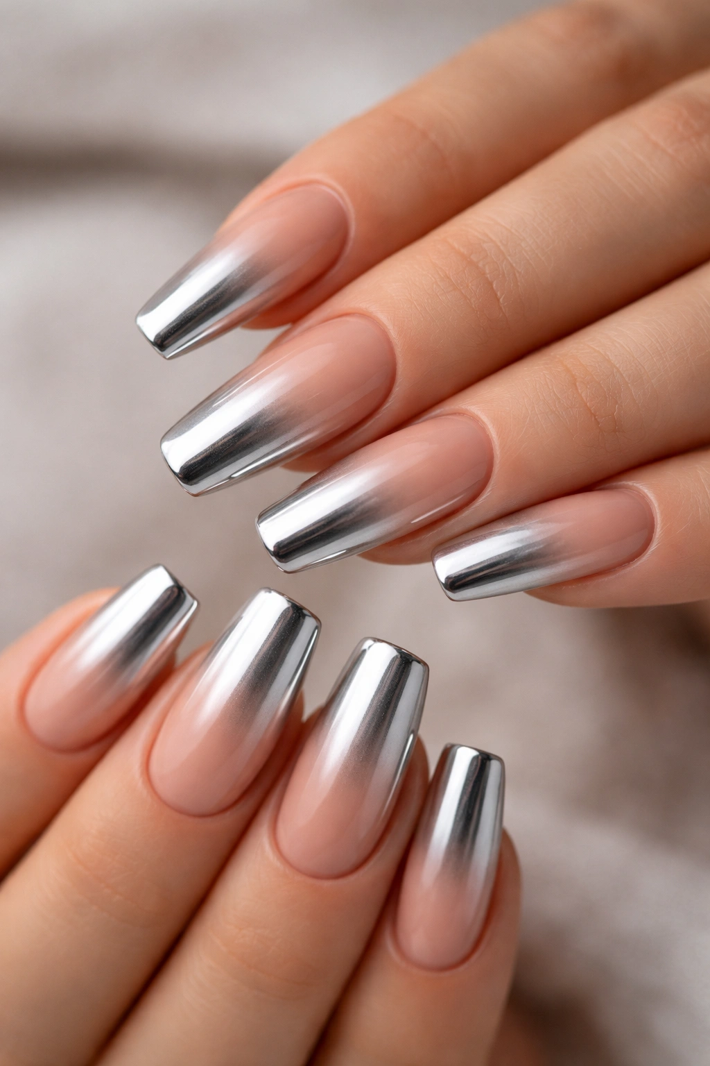 Nude-to-silver chrome ombre on ballerina nails with soft gradient