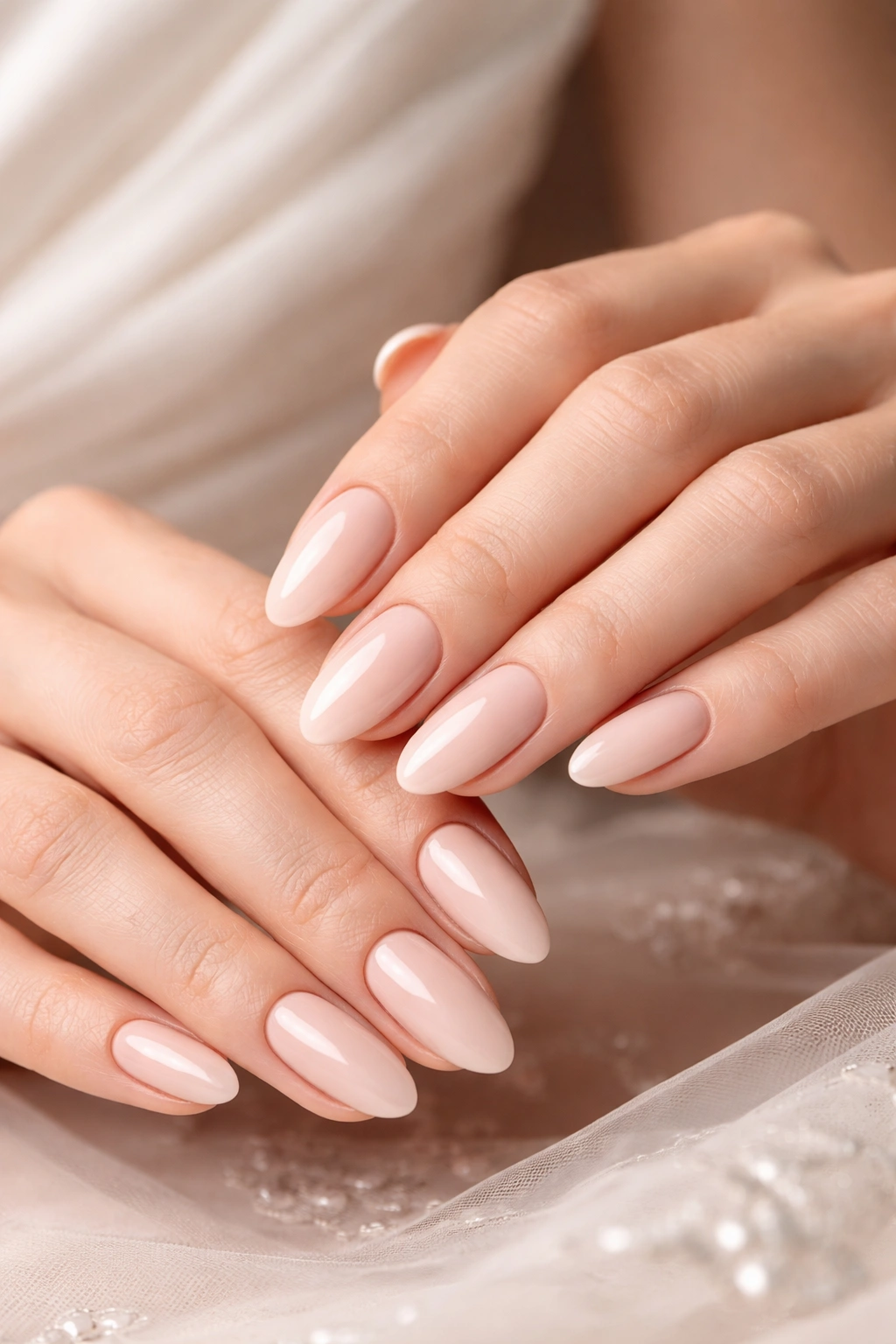 Close-up of hands with nails painted in a versatile neutral shade